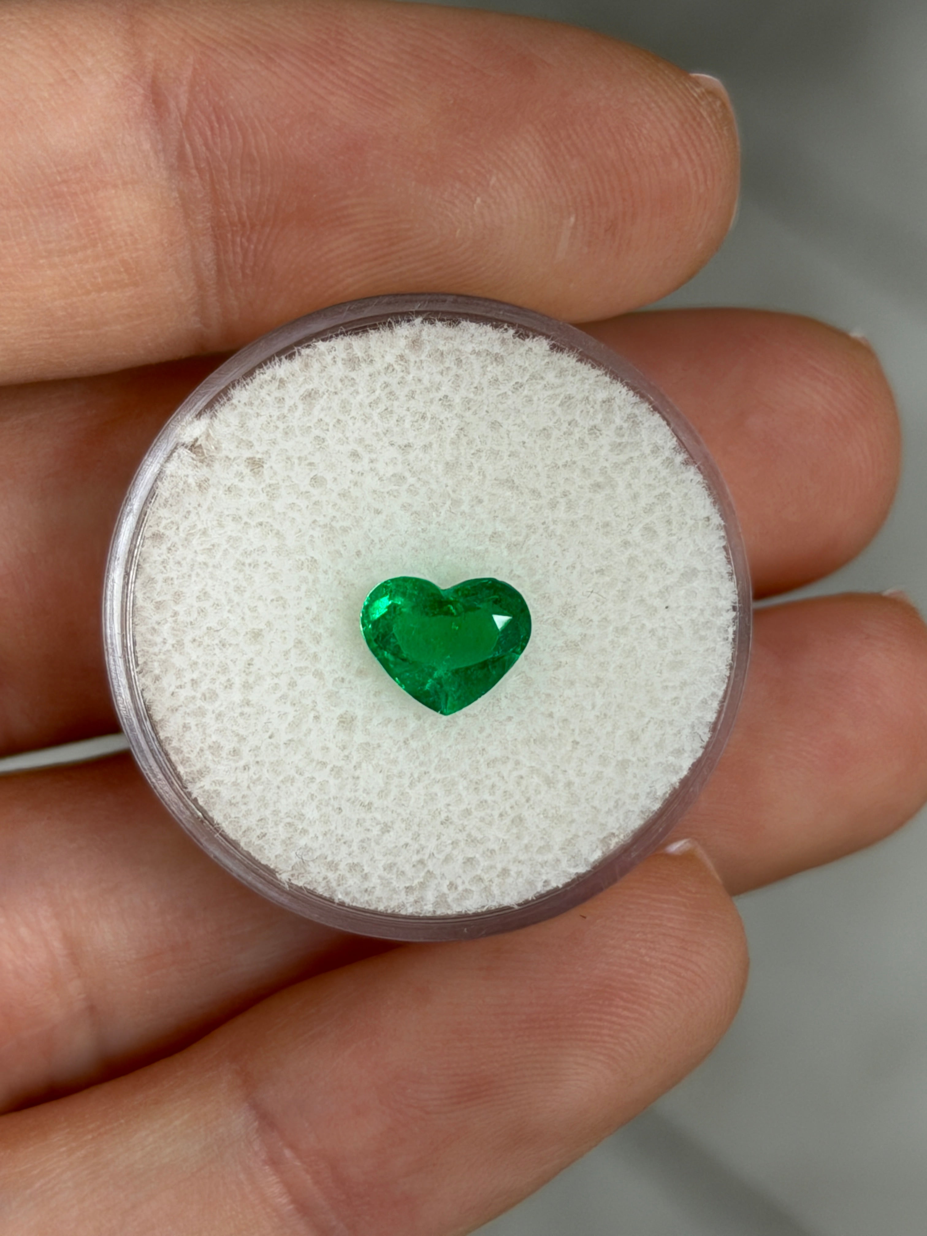 Vivid green 0.95 carat Colombian emerald loose heart cut from JR Colombian Emeralds, AAA+ quality, natural Muzo green gemstone.