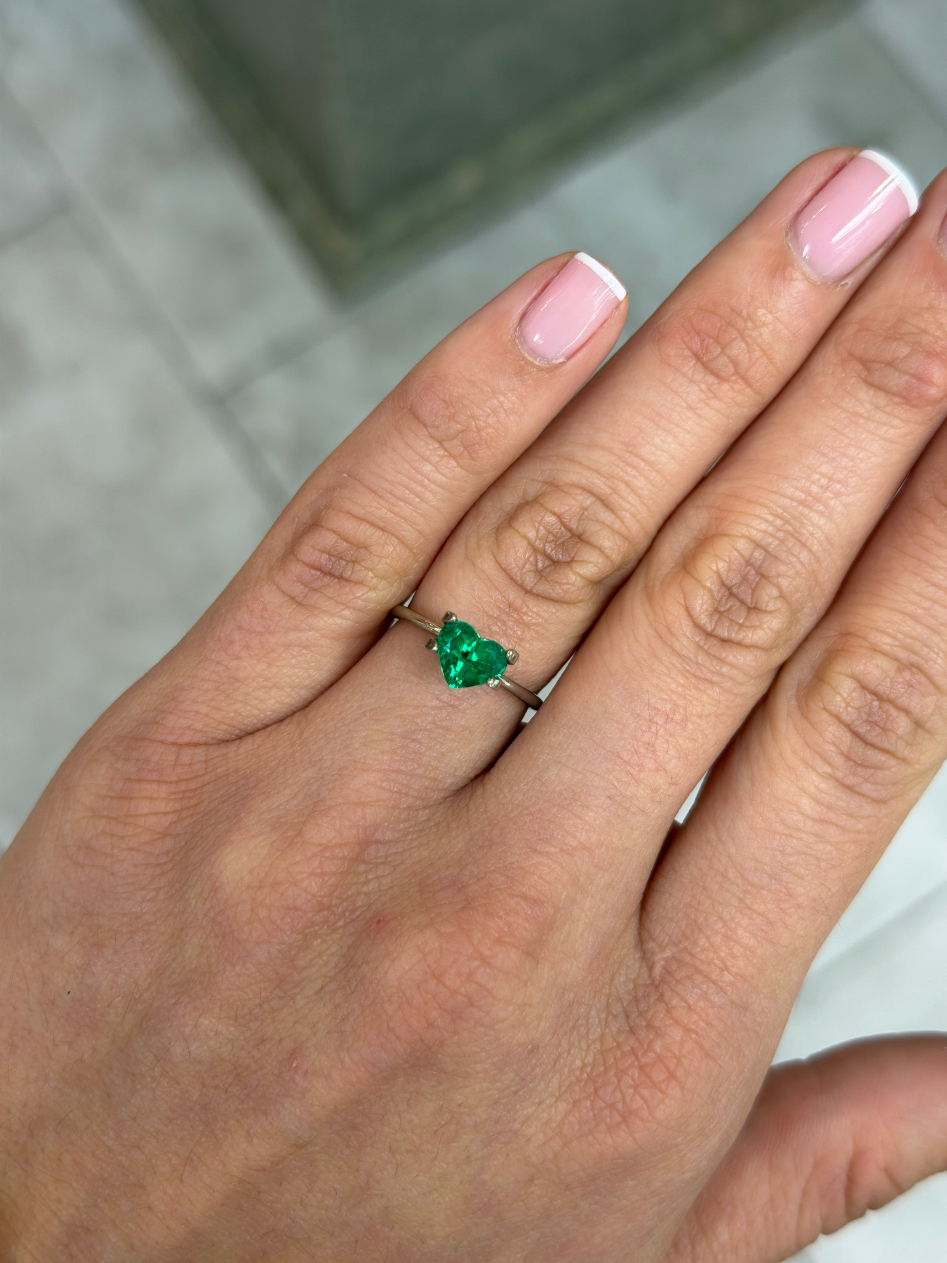 Loose 0.97 carat Colombian emerald in heart cut, AAA+ crystal clear Muzo green, natural gemstone by JR Colombian Emeralds.