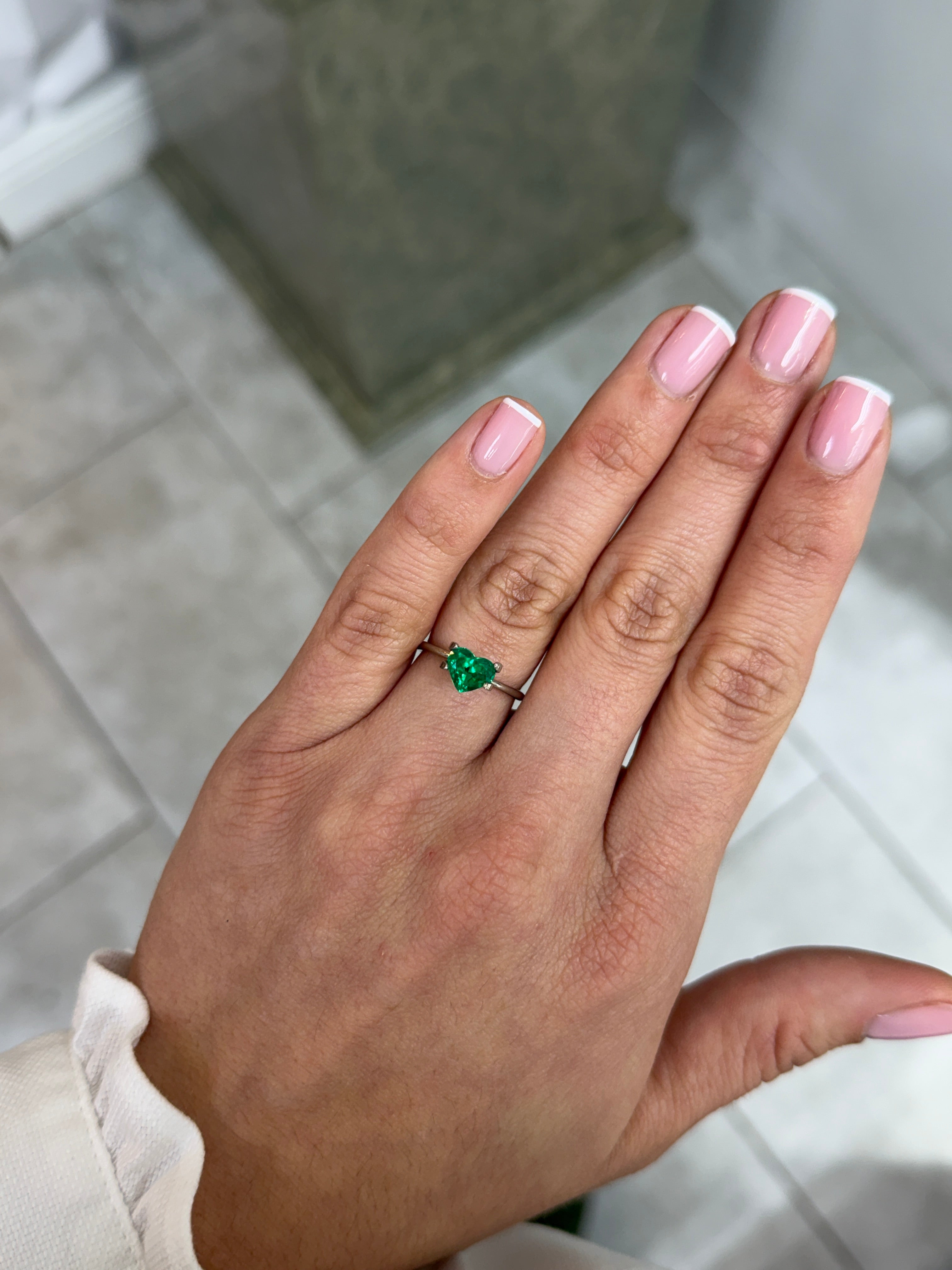 Loose 0.97 carat Muzo green Colombian emerald in heart cut, crystal clear AAA+ quality, natural and vibrant gemstone.