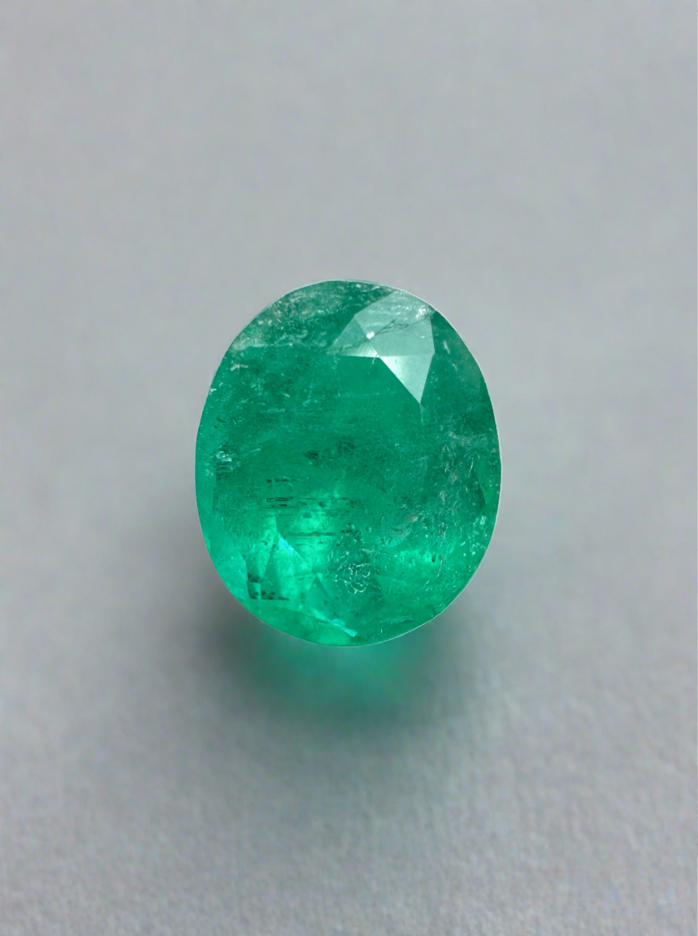 Oval cut 1.19 carat semi-transparent green Colombian emerald gemstone from JR Colombian Emeralds, natural and rich in color.