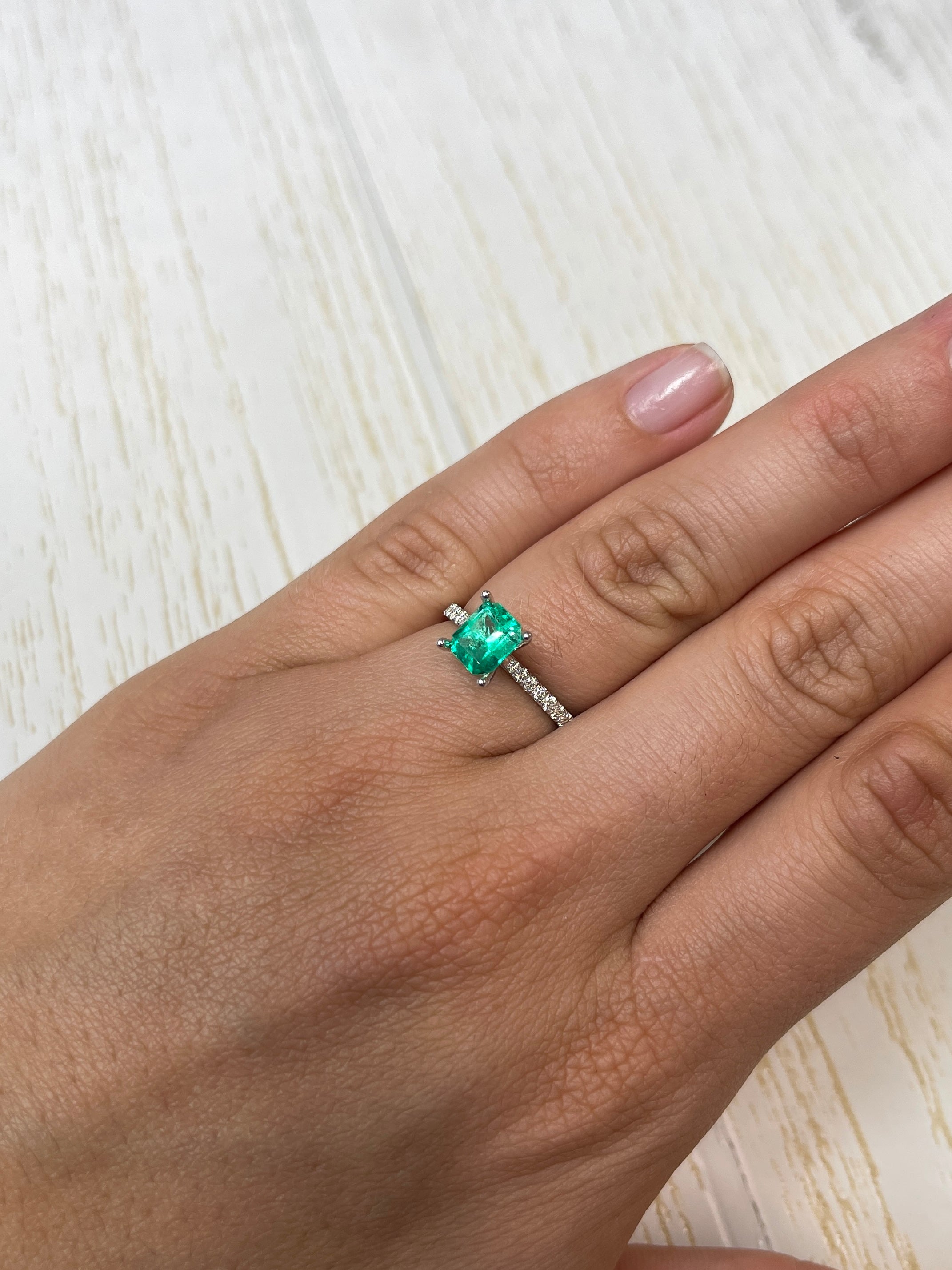 Natural 1.20 Carat 7x6mm yellowish green Colombian emerald in emerald cut, from JR Colombian Emeralds.