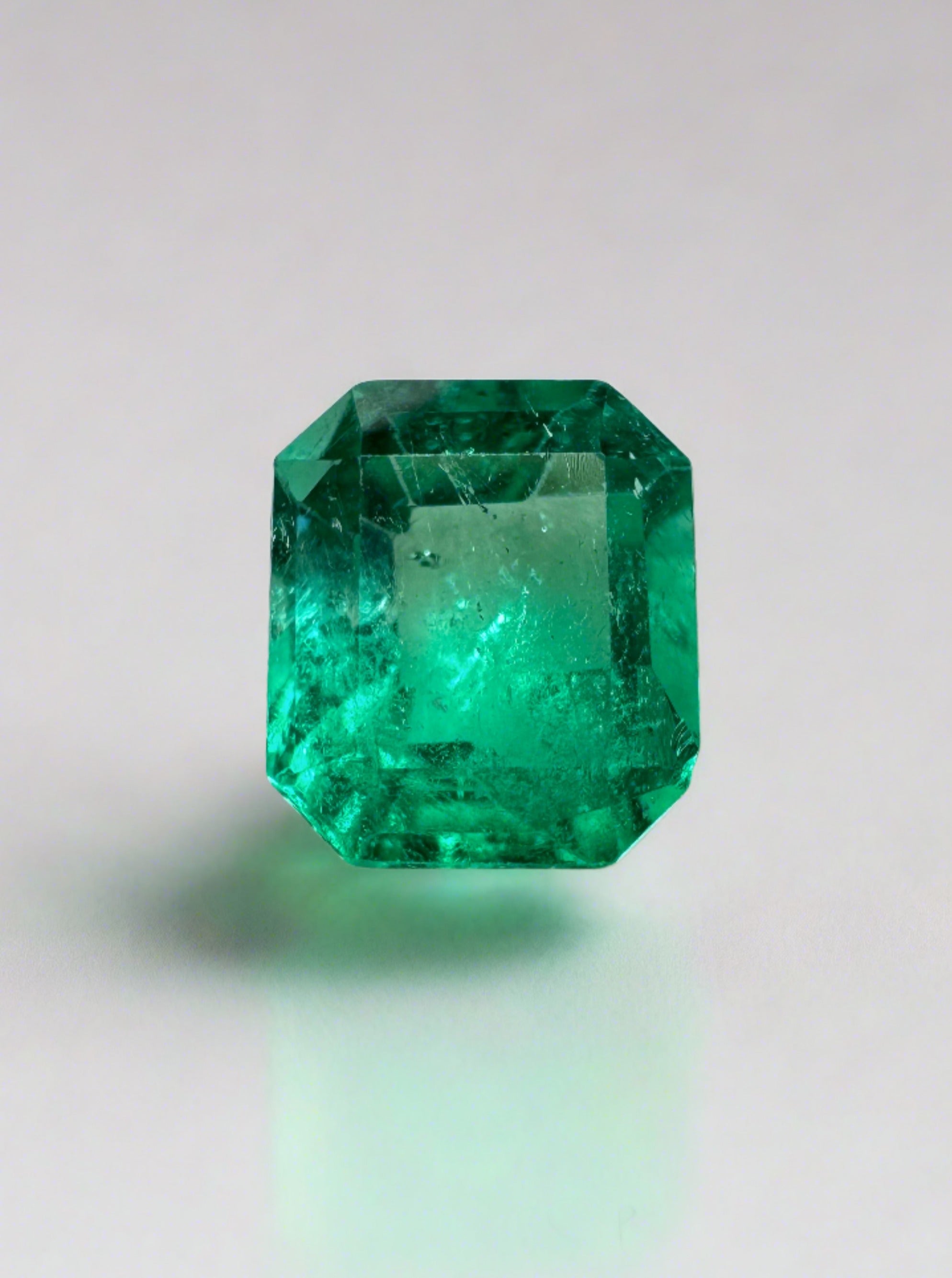 Natural 1.20 carat yellowish green Colombian emerald loose gemstone in an emerald cut by JR Colombian Emeralds.