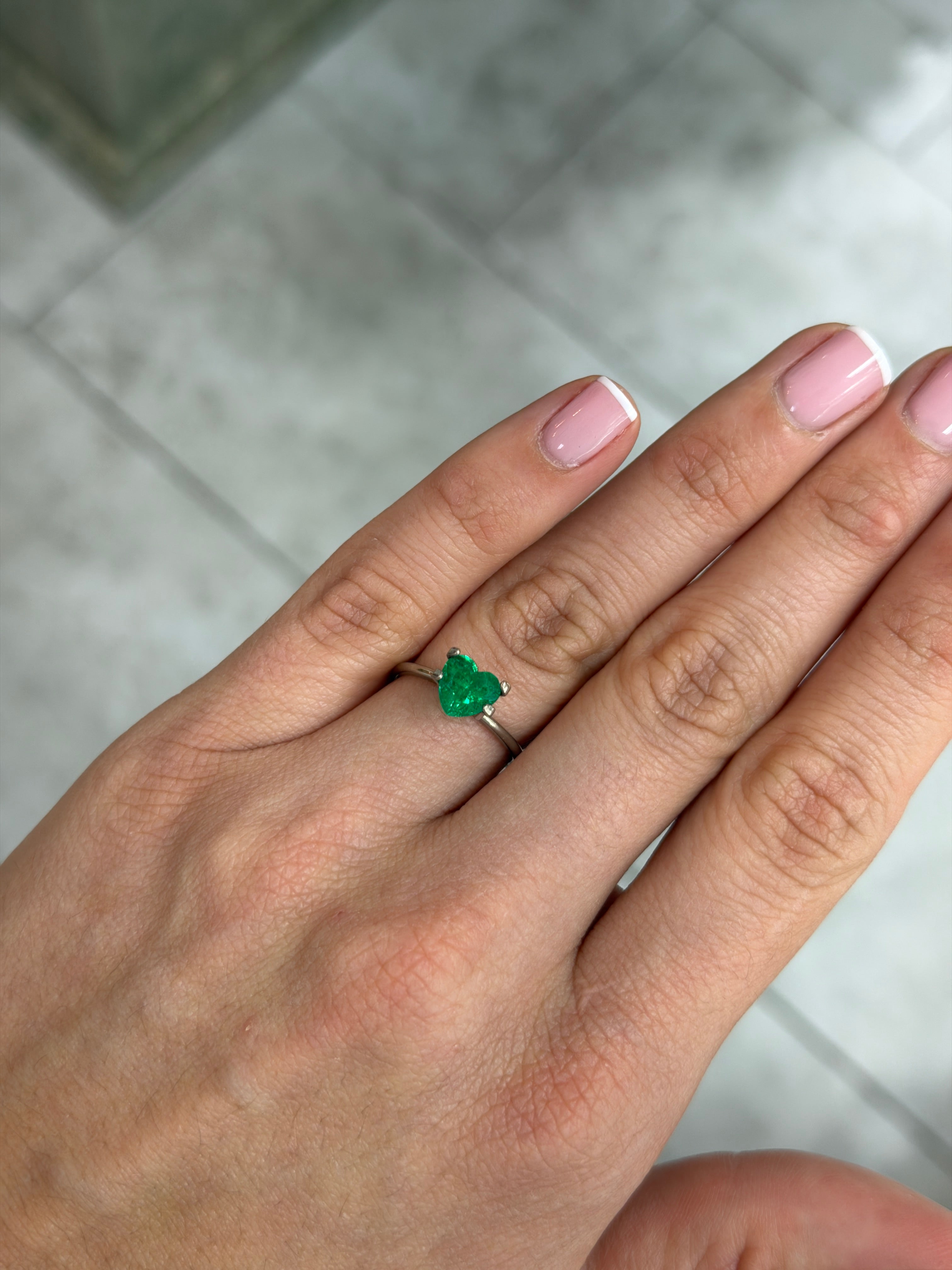 7x7 mm AAA+ Vivid Muzo green Colombian emerald in heart cut, natural loose gemstone with 1.22 carats from JR Colombian Emeralds.