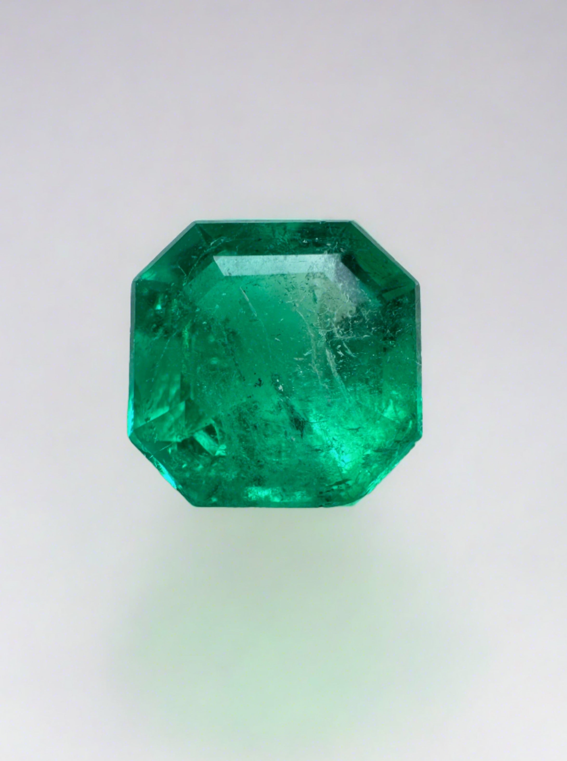 Bluish green 1.24 carat Asscher cut Colombian emerald by JR Colombian Emeralds, natural and unset, with precise 6.7x6.7mm dimensions.