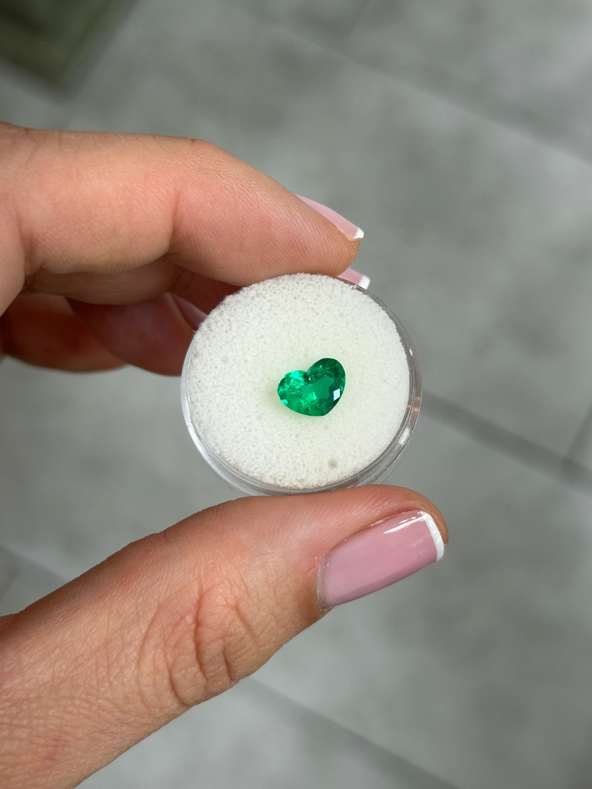 1.28 carat Colombian emerald loose heart-shaped cut with AAA+ vivid intense Muzo green color by JR Colombian Emeralds