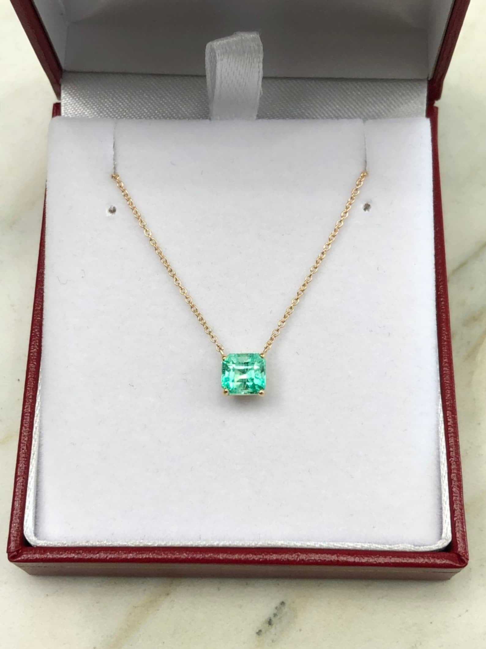 Rich green 1.30 carat Colombian emerald solitaire necklace with emerald cut in 14K gold by JR Colombian Emeralds