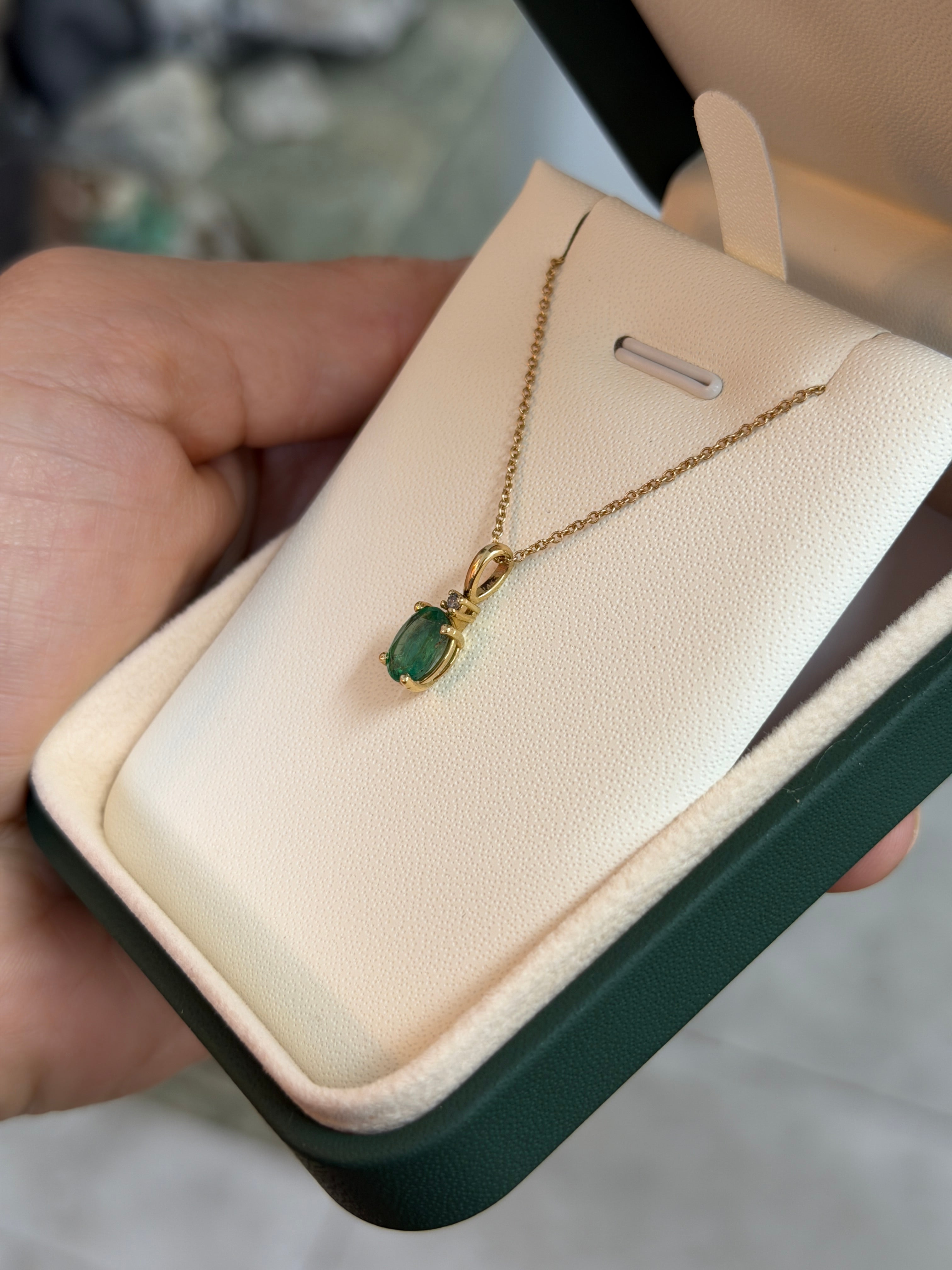 14K yellow gold pendant necklace with 1.30tcw oval cut natural emerald and diamond accents, from JR Colombian Emeralds.