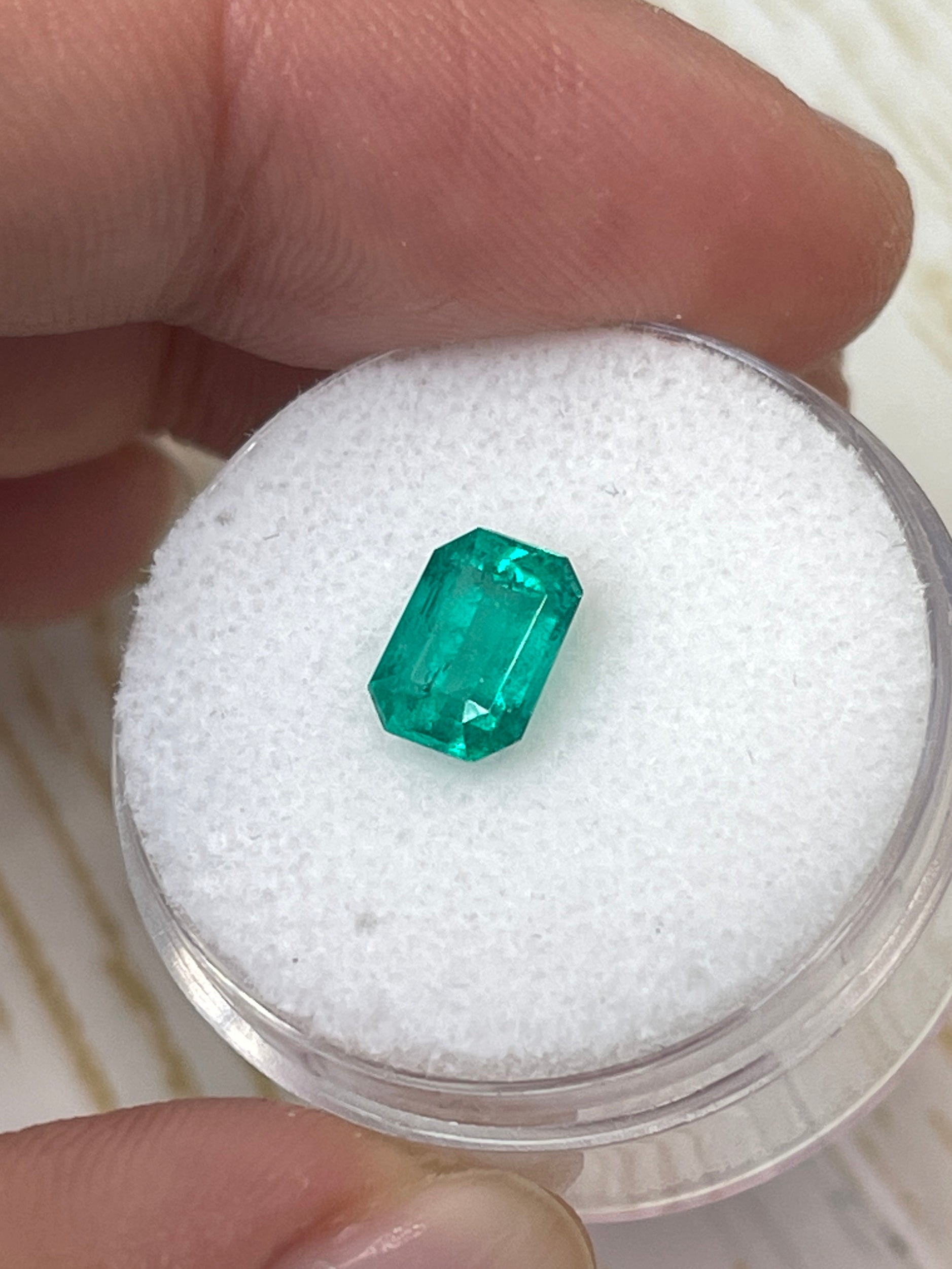 Loose 1.31 carat Colombian emerald in an emerald cut, showcasing vibrant green color and clarity from JR Colombian Emeralds.
