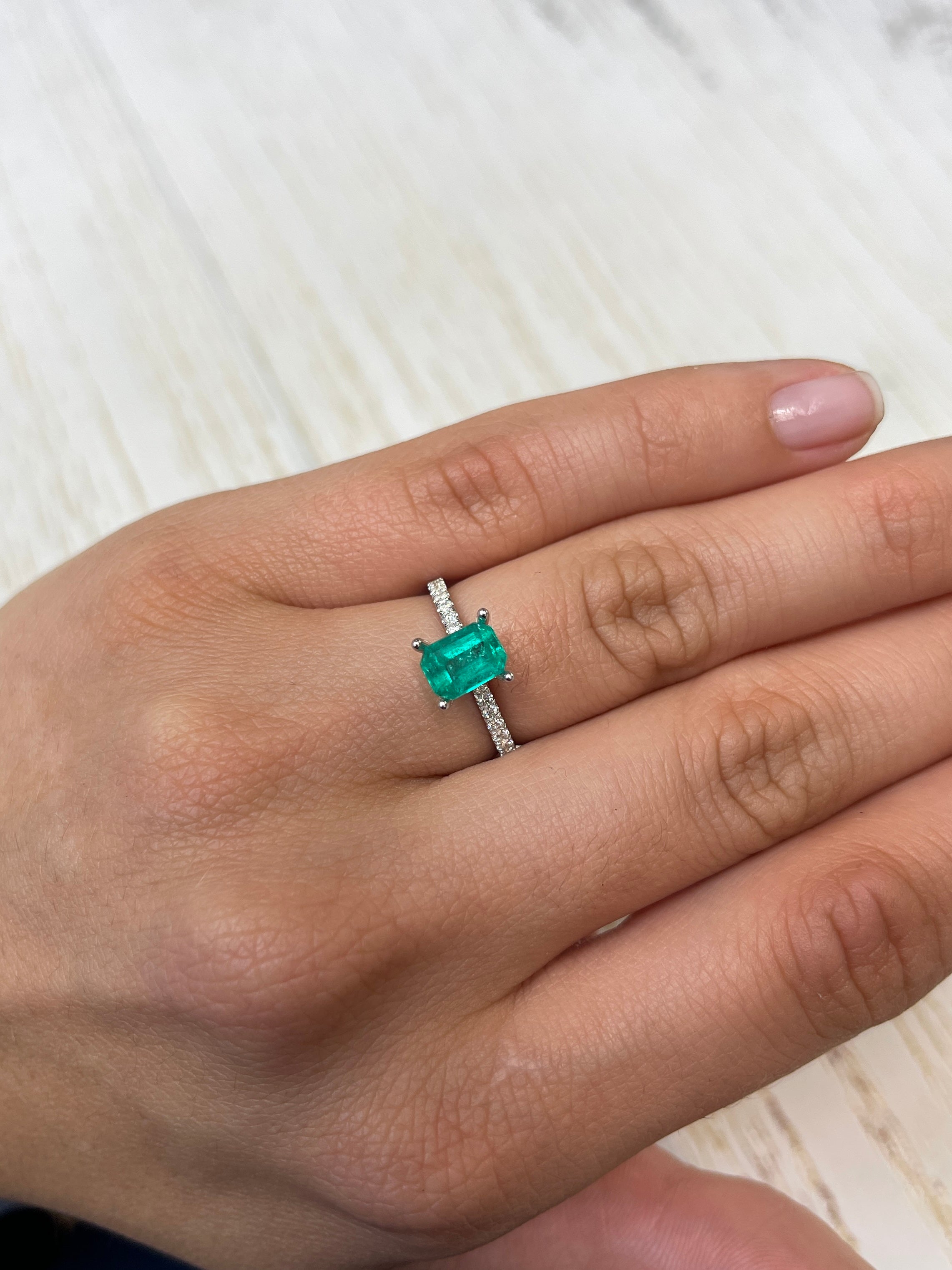 1.31 carat Colombian emerald loose gemstone in an emerald cut, showcasing vibrant green color and clarity from JR Colombian Emeralds.