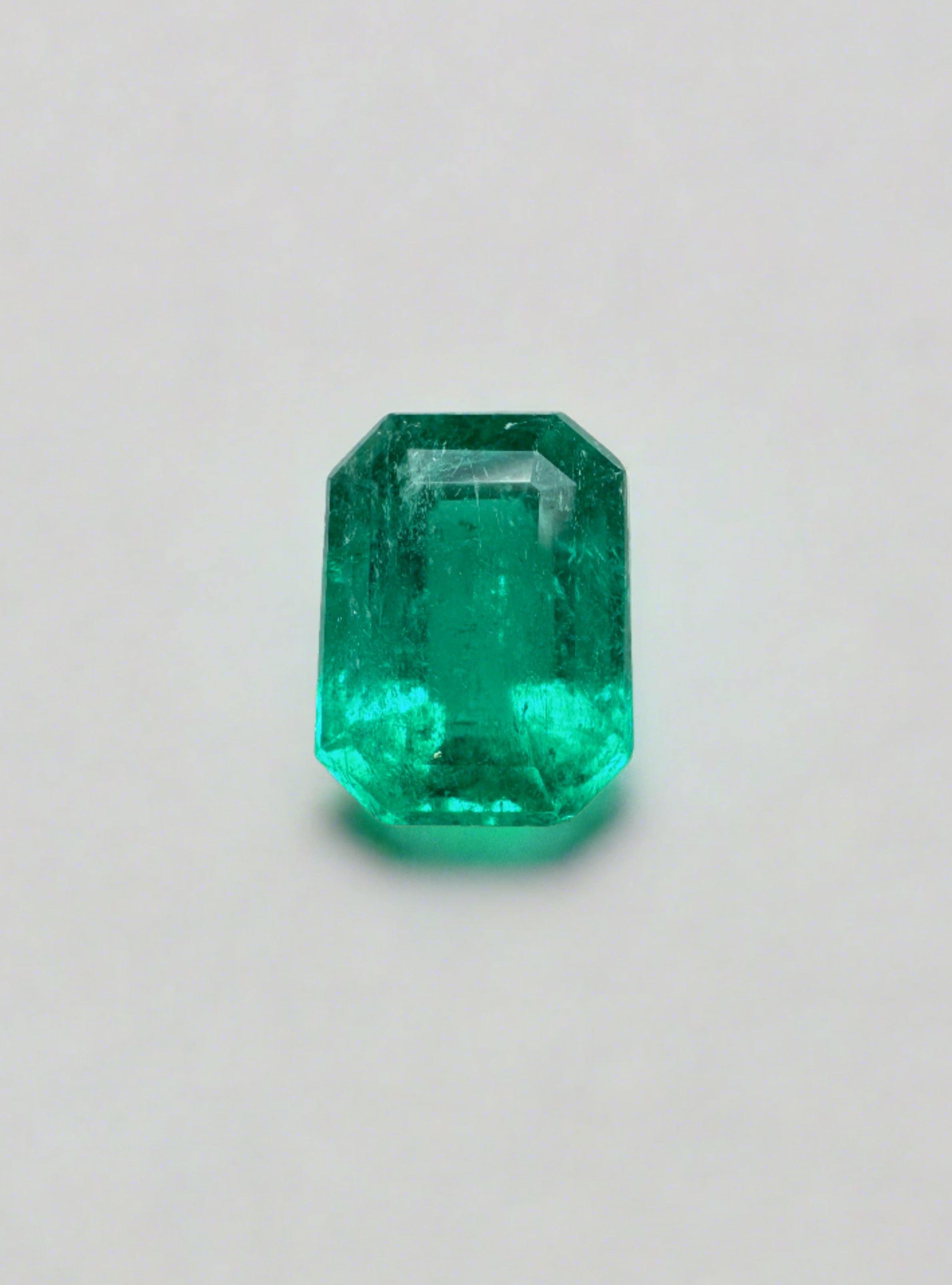 Loose 1.31 carat Colombian emerald with an 8x6 emerald cut, showcasing vibrant green color and clarity.