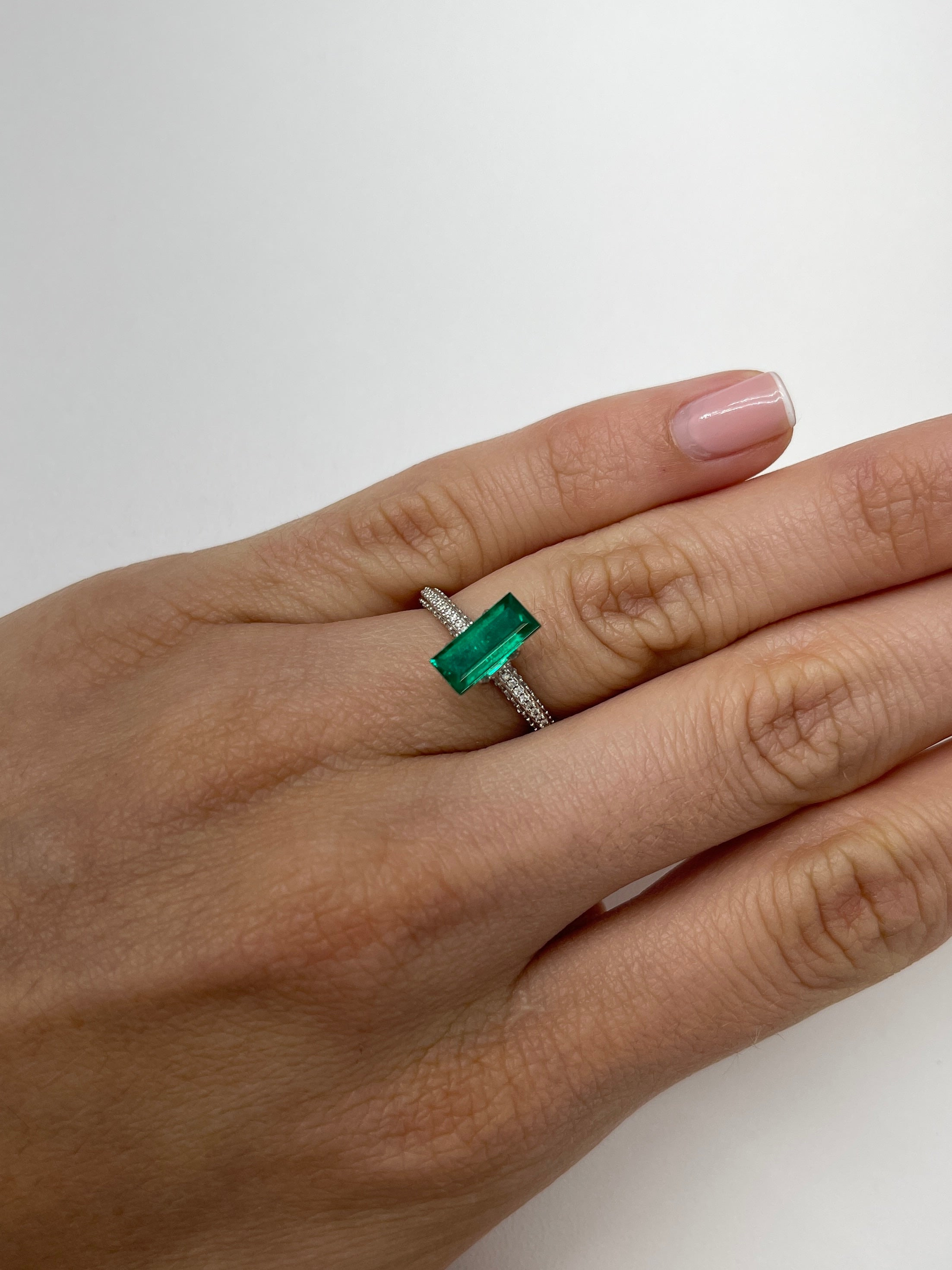 Natural 1.38 Carat AAA+ Muzo Colombian Emerald Baguette, loose gemstone with vibrant green color and rectangular cut from JR Colombian Emeralds.