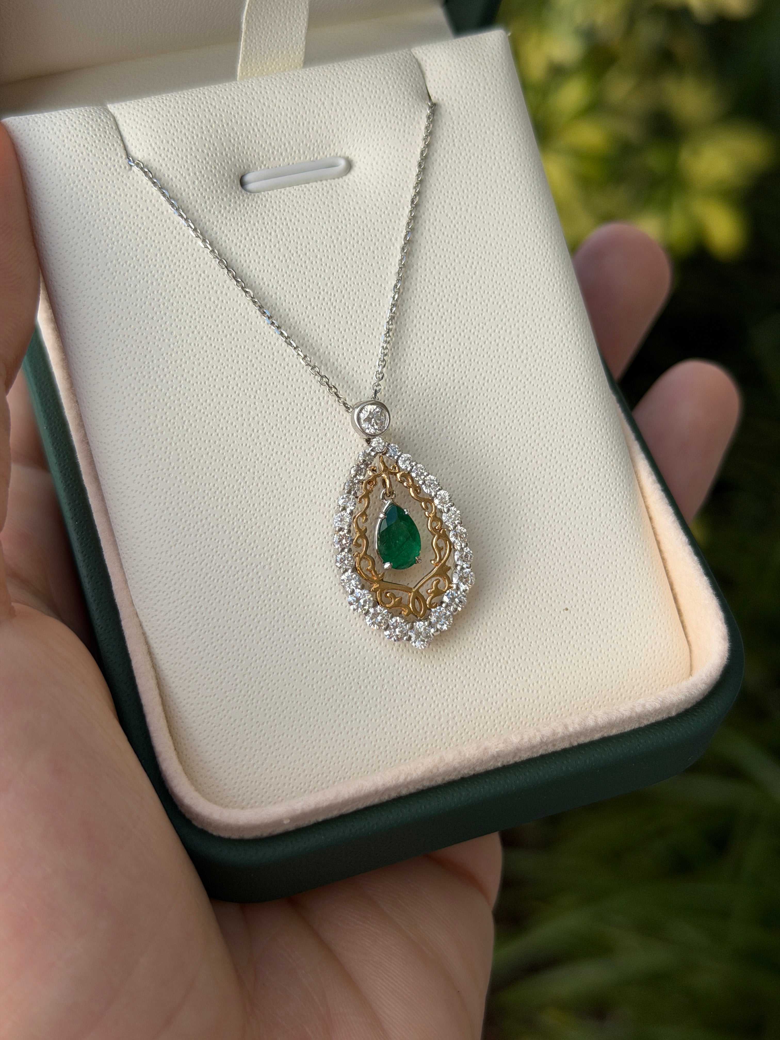 Pear-shaped emerald and diamond statement necklace in two-tone 14K gold by JR Colombian Emeralds, featuring a 1.43tcw gemstone design.