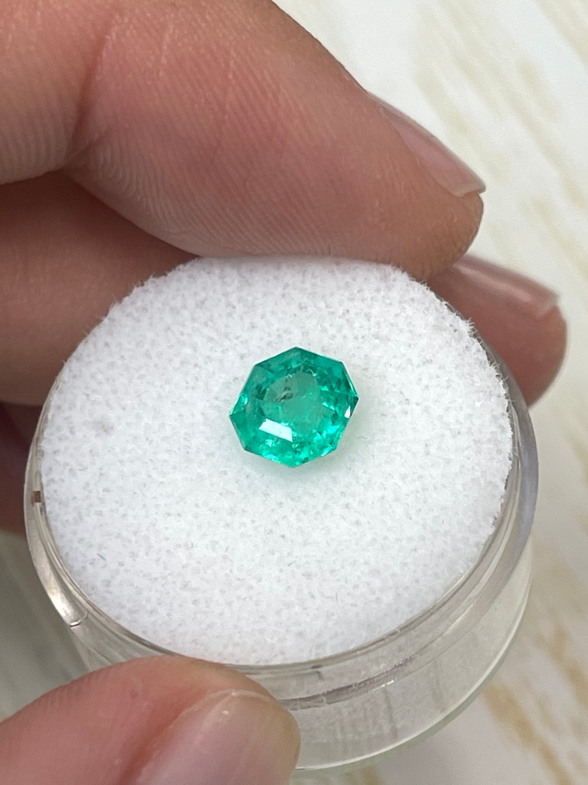 Bluish green 7x7mm octagon cut natural Colombian emerald gemstone, unset and crafted by JR Colombian Emeralds.
