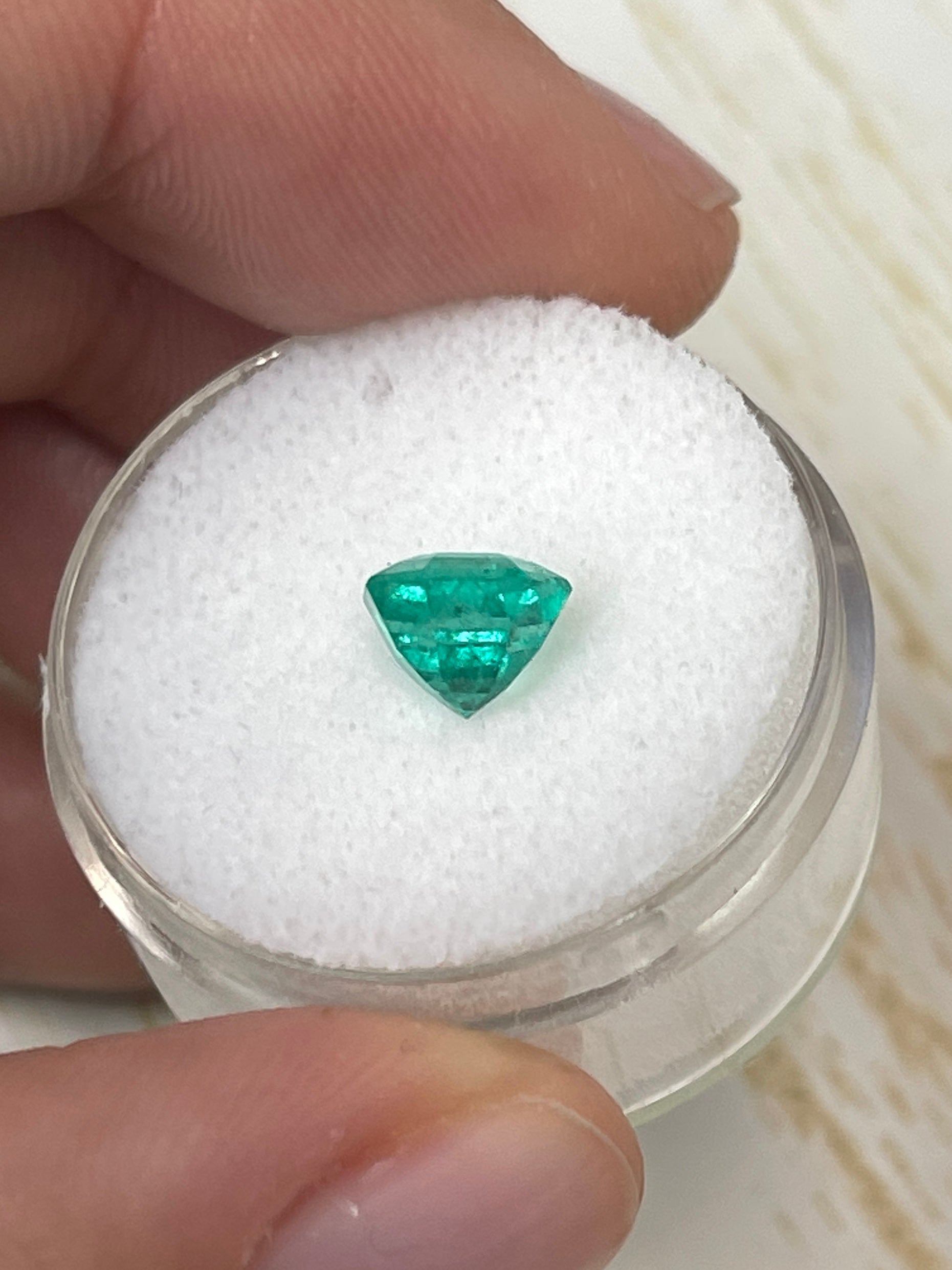 Bluish green 7x7 carat octagon cut natural Colombian emerald by JR Colombian Emeralds, unset gemstone with vibrant color.