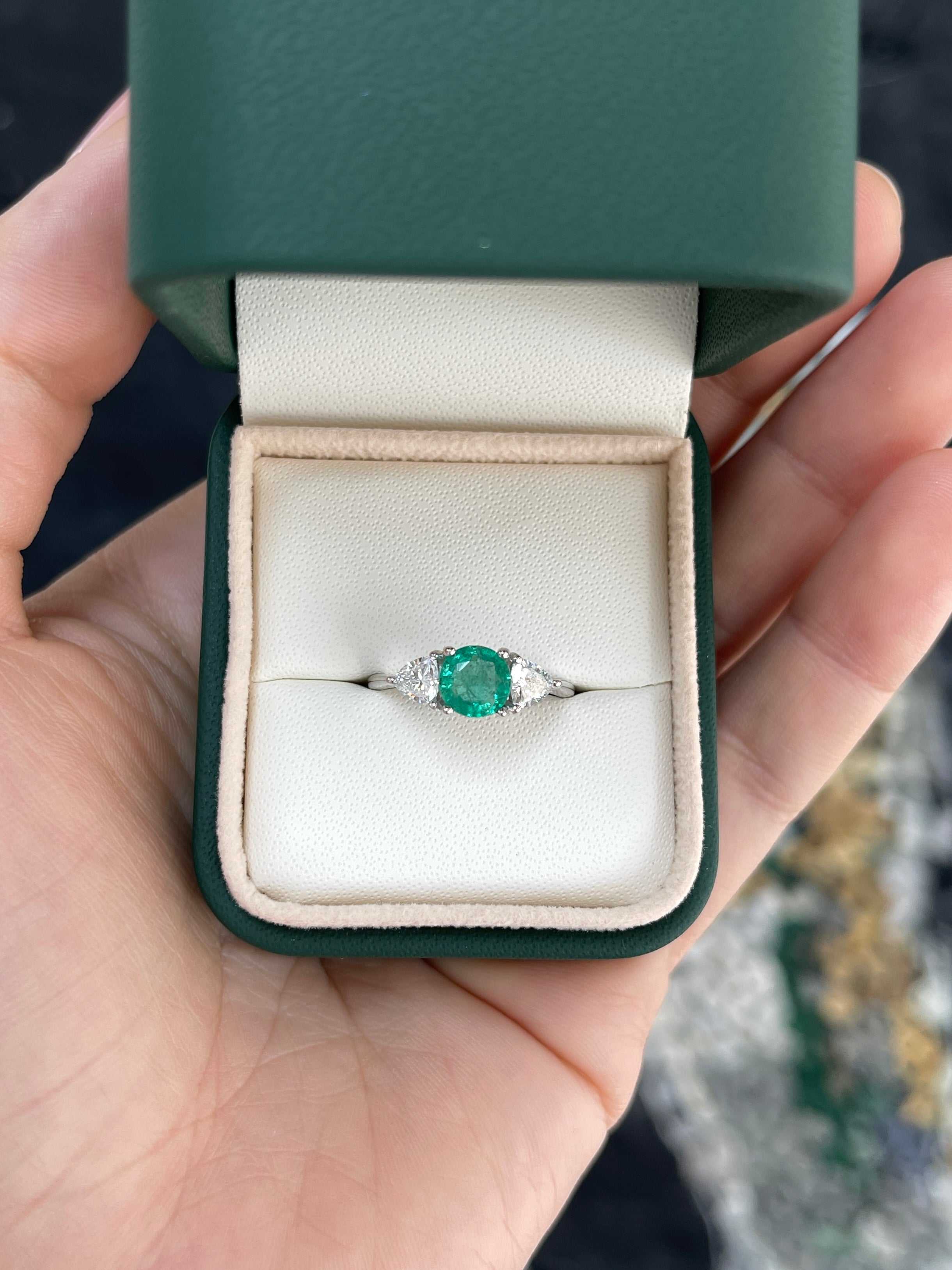 Natural round emerald and trillion lab diamond three-stone ring in 14K gold by JR Colombian Emeralds, showcasing sparkling gemstones.