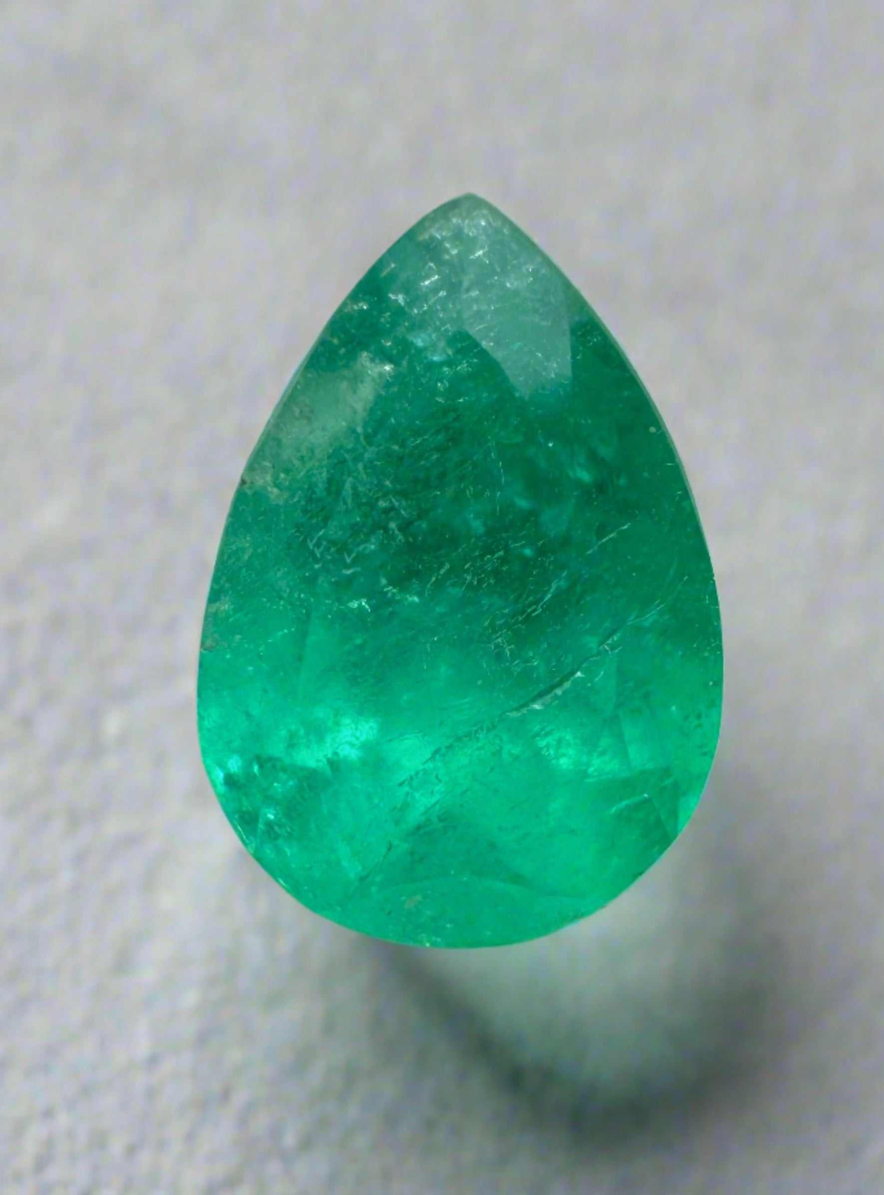 Natural 1.58 carat medium green Colombian emerald loose pear cut gemstone from JR Colombian Emeralds.