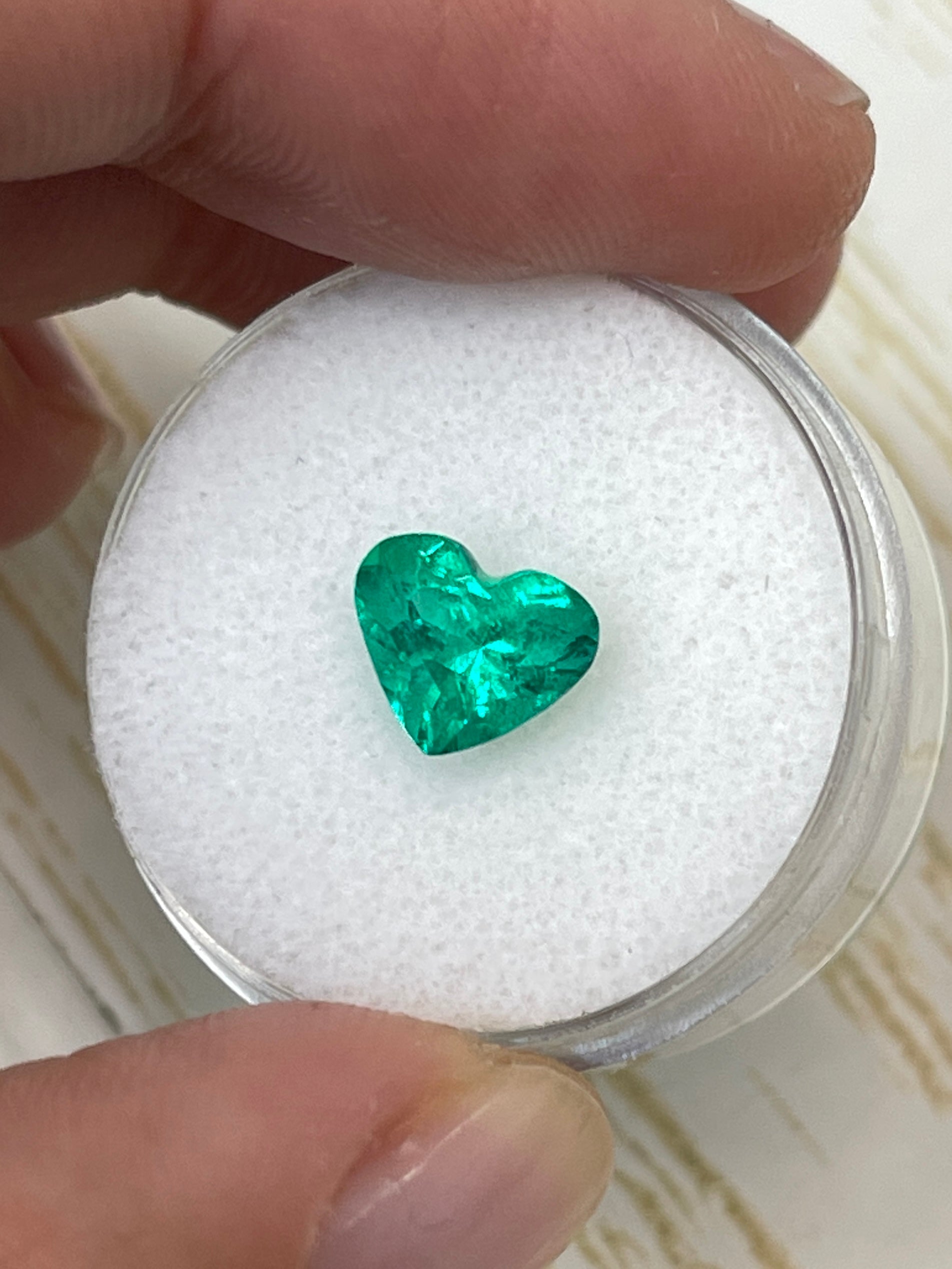 1.62 carat VS clarity green Colombian emerald loose heart cut gemstone by JR Colombian Emeralds.