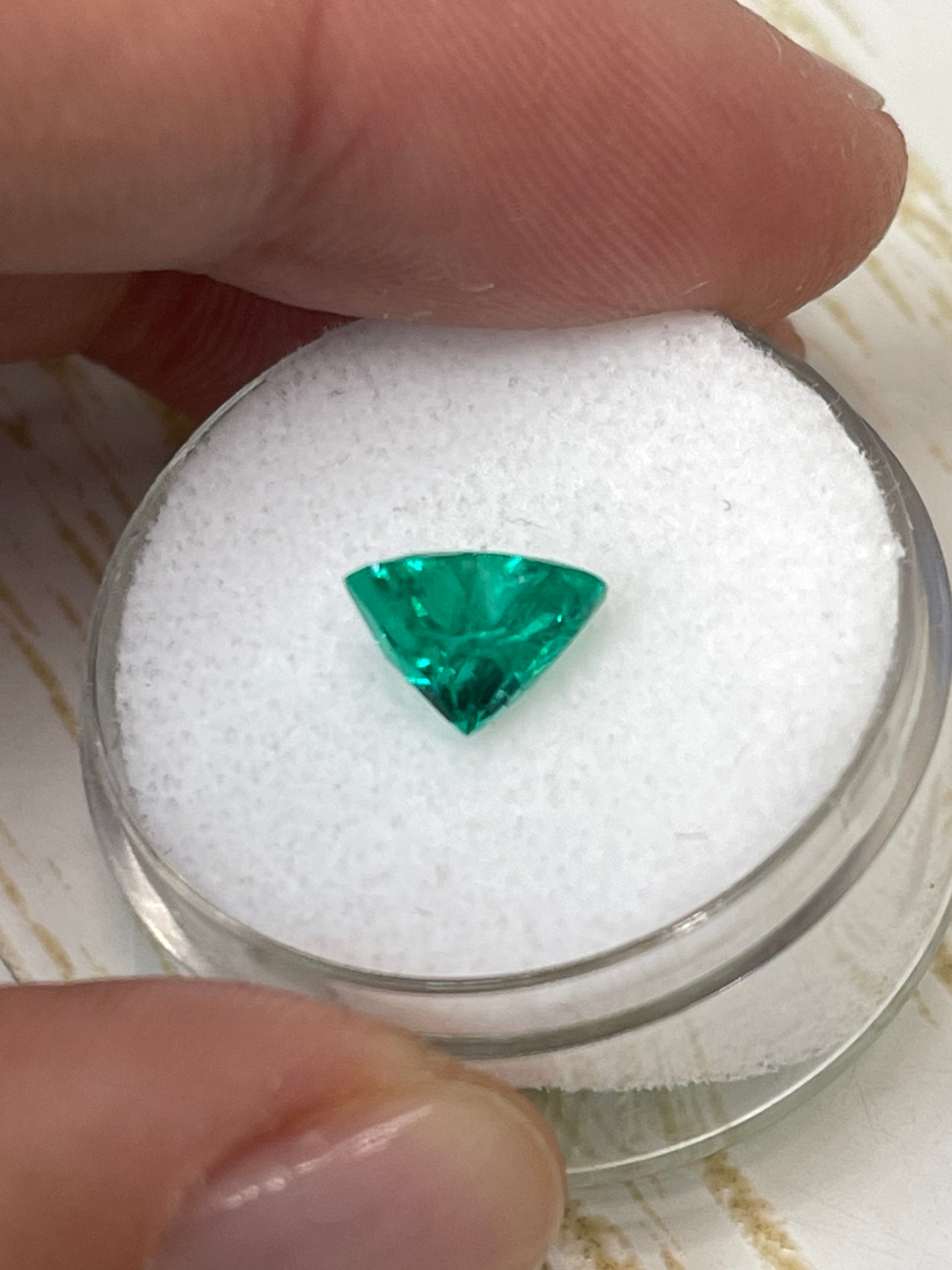 1.62 carat VS clarity green natural Colombian emerald in heart cut, loose gemstone, showcasing vibrant color and clarity.