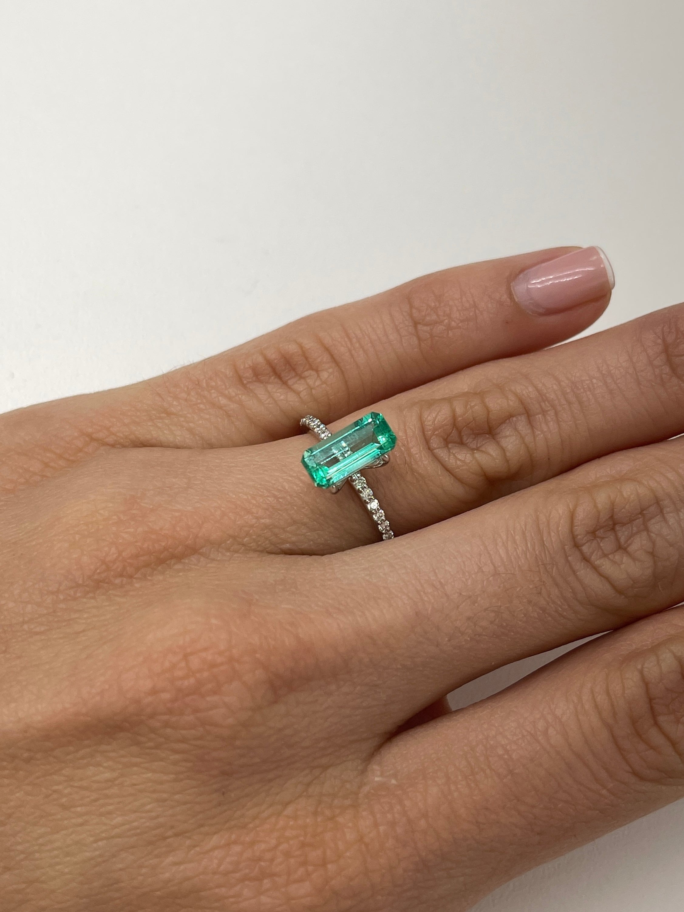 1.65 carat natural Colombian emerald loose gemstone with elongated emerald cut, crystalline clarity, from JR Colombian Emeralds.