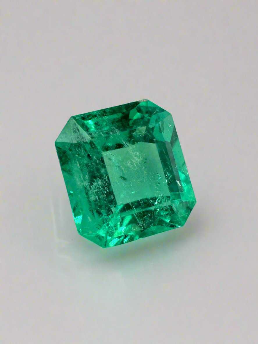 1.68 carat yellowish green Colombian emerald in asscher cut, showcasing crystalline clarity and vibrant color.