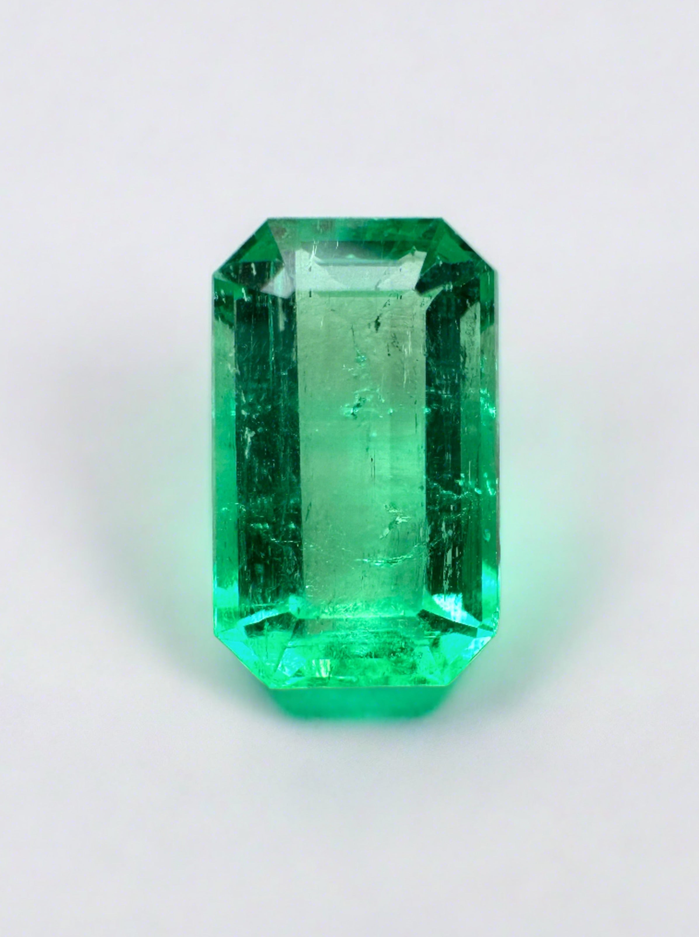 Yellowish green 1.68 carat natural Colombian emerald loose gemstone in emerald cut, from JR Colombian Emeralds.