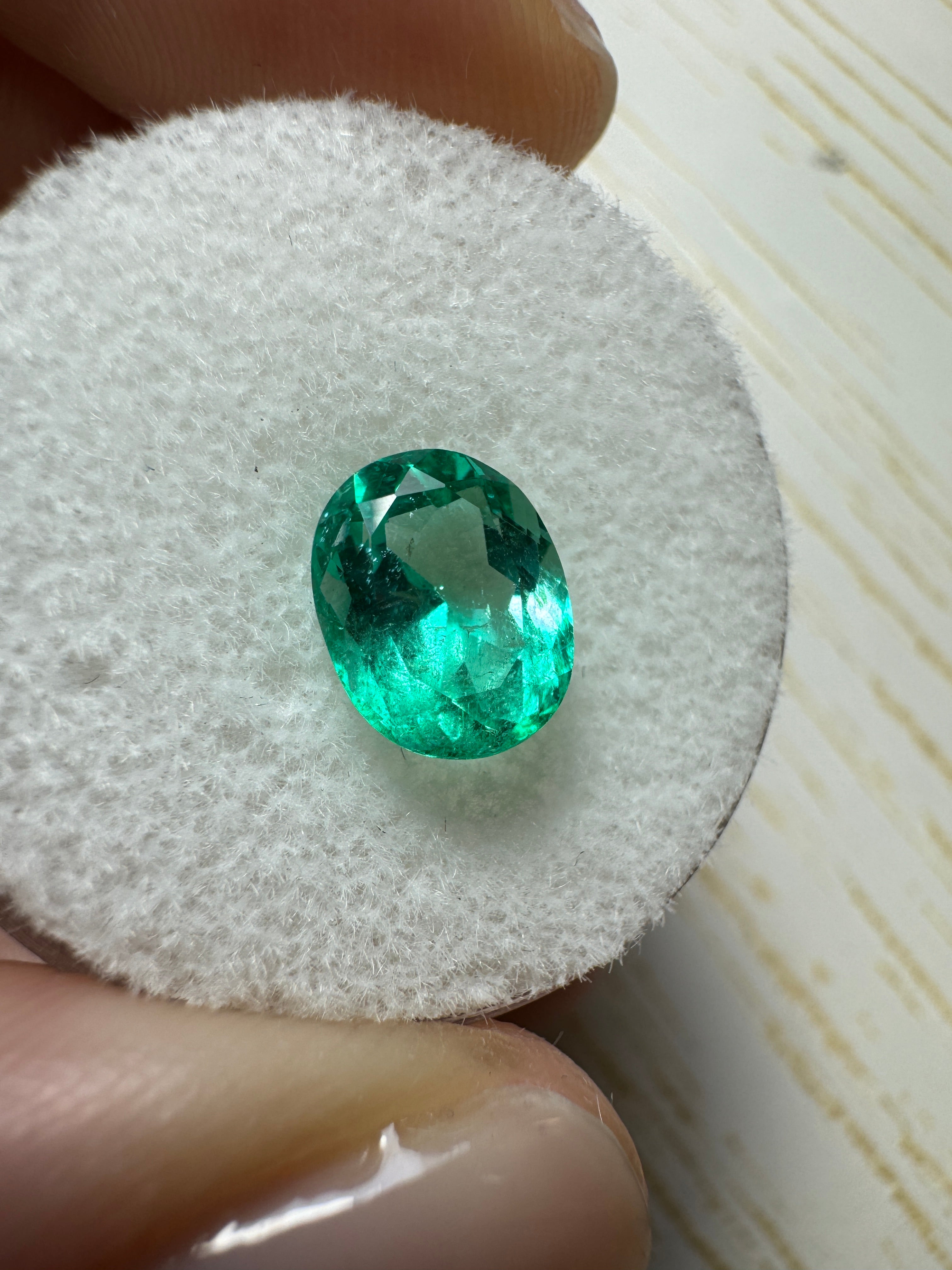 Natural 1.72 carat Spring Green Colombian emerald loose oval cut gemstone from JR Colombian Emeralds, crystalline and vibrant.
