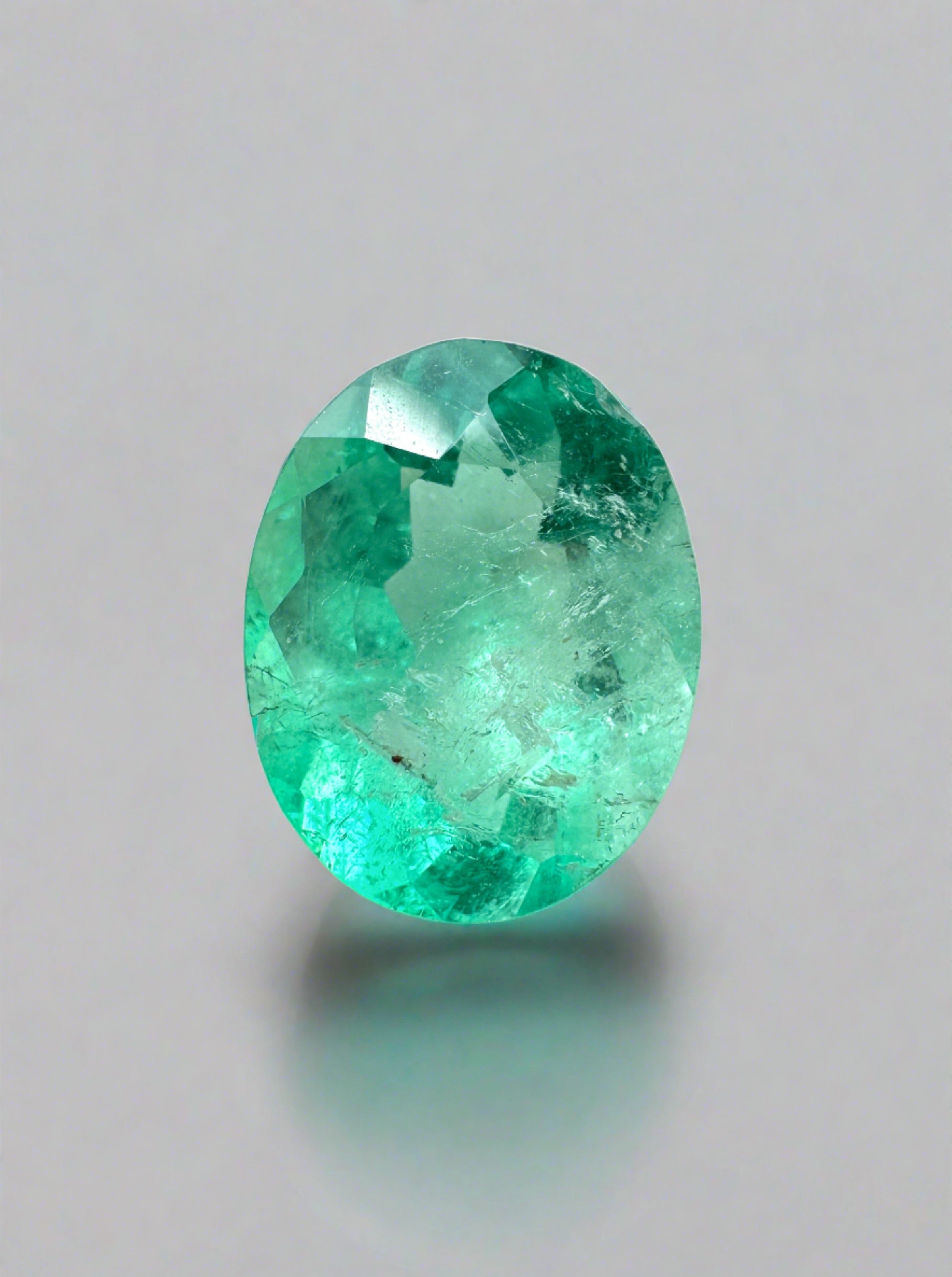 1.77 carat medium light green natural Colombian emerald loose oval cut gemstone, vibrant and expertly cut by JR Colombian Emeralds.