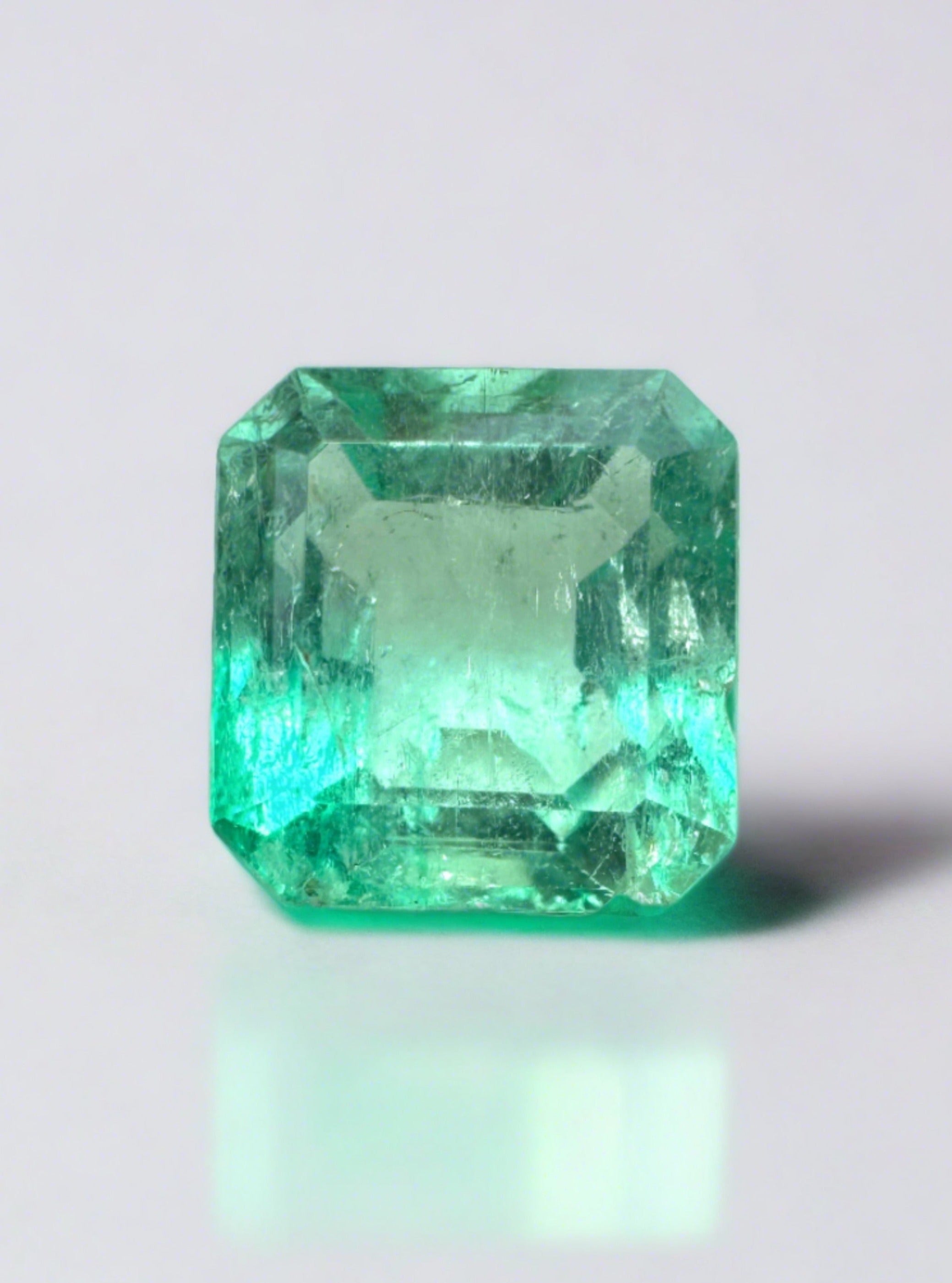Unset 1.78 carat Colombian emerald with chipped limish green Asscher cut, natural gemstone from JR Colombian Emeralds.