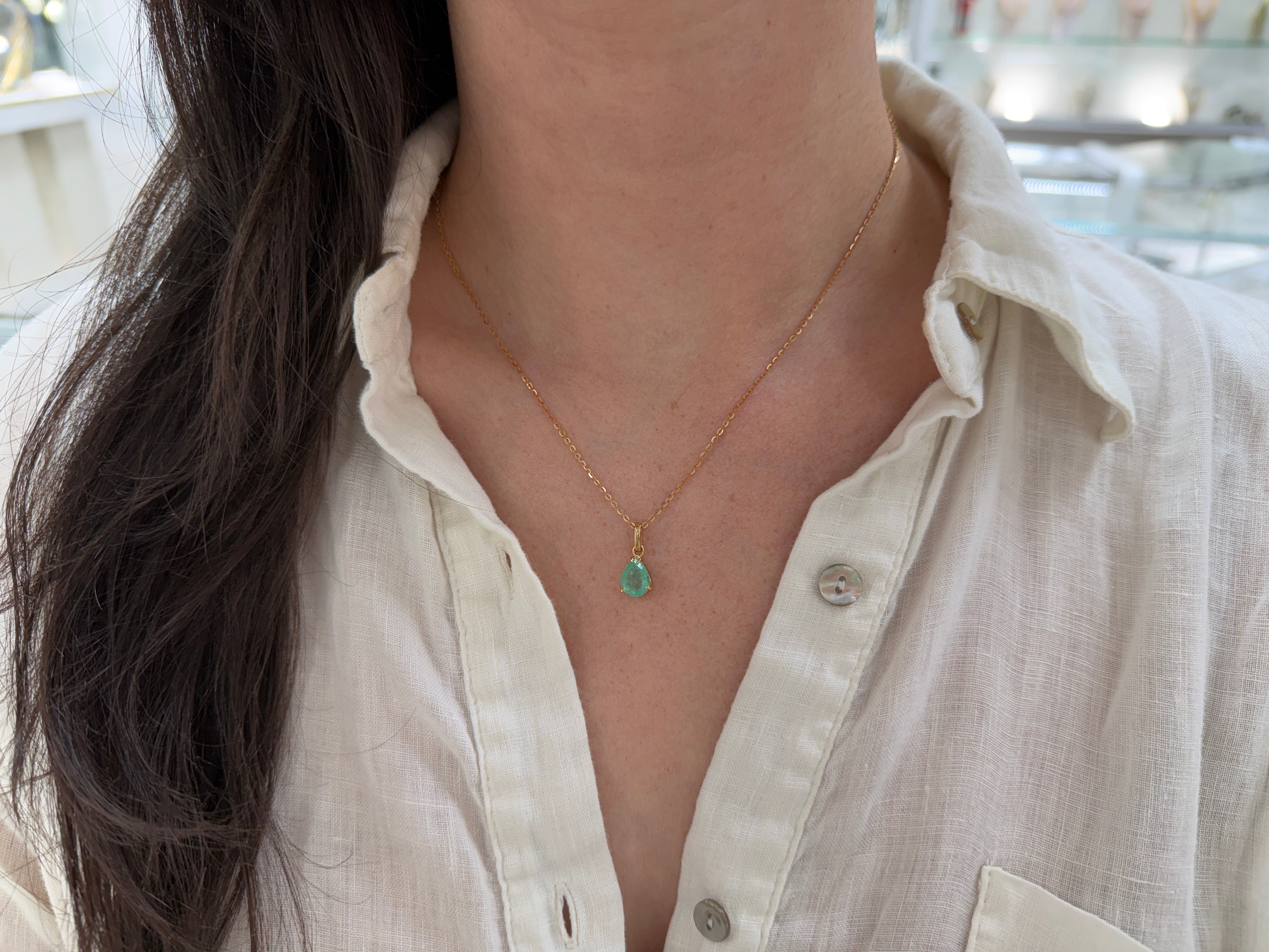 Light green Colombian emerald solitaire necklace with a 1.80 carat pear cut emerald by JR Colombian Emeralds.