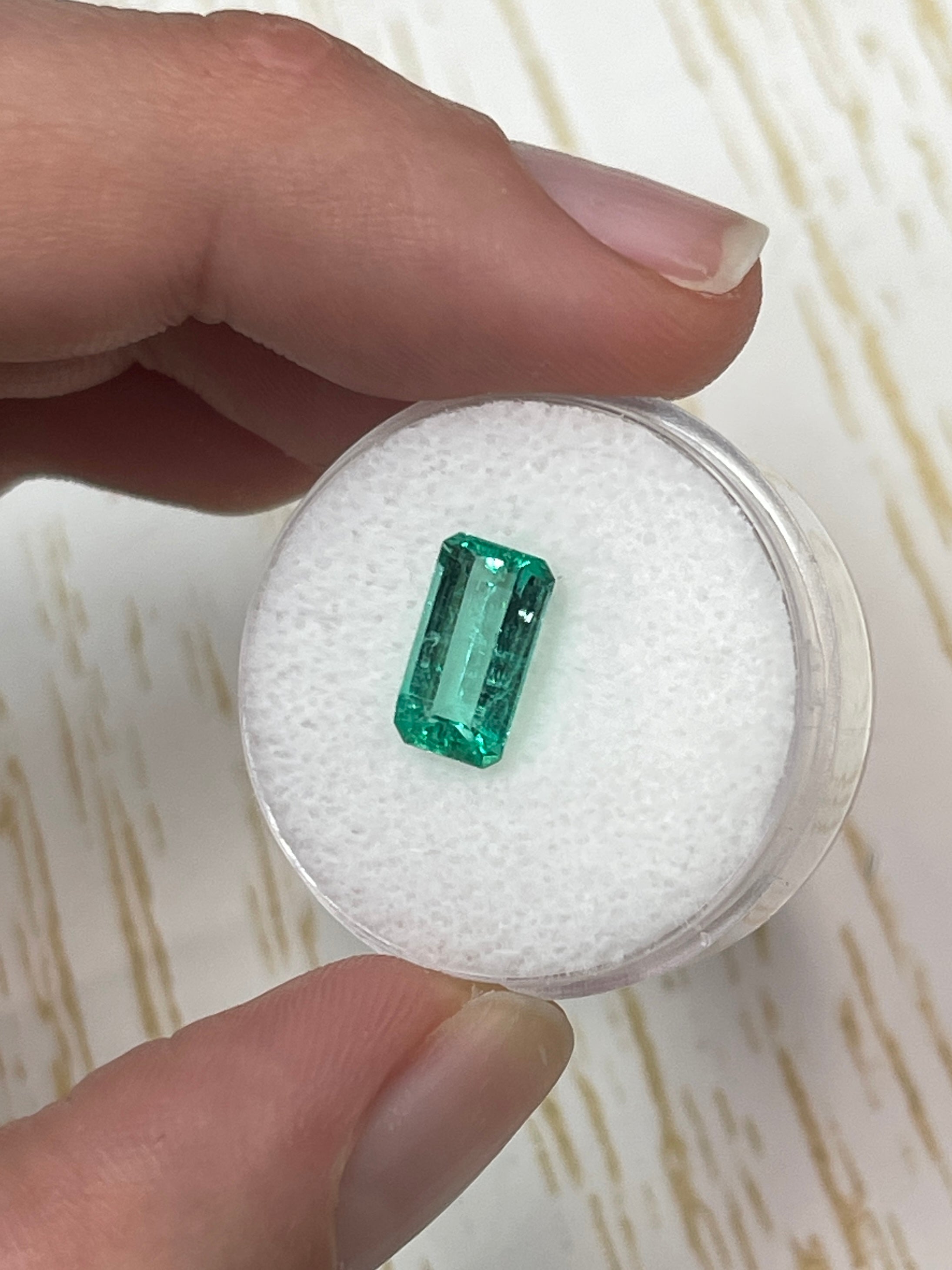 Loose 1.80 carat VVS Colombian emerald, 10x6 mm slender cut, bluish green, high clarity gemstone from JR Colombian Emeralds.