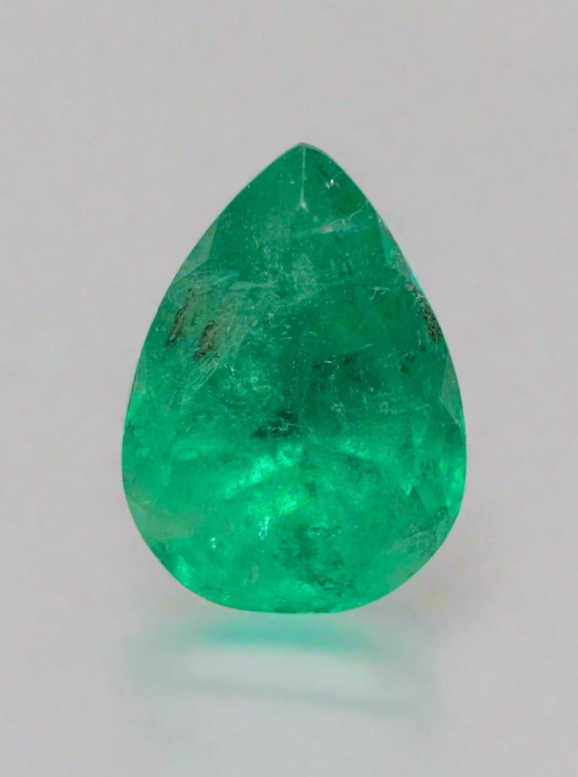 1.81 carat spring green natural Colombian emerald loose pear cut gemstone by JR Colombian Emeralds.