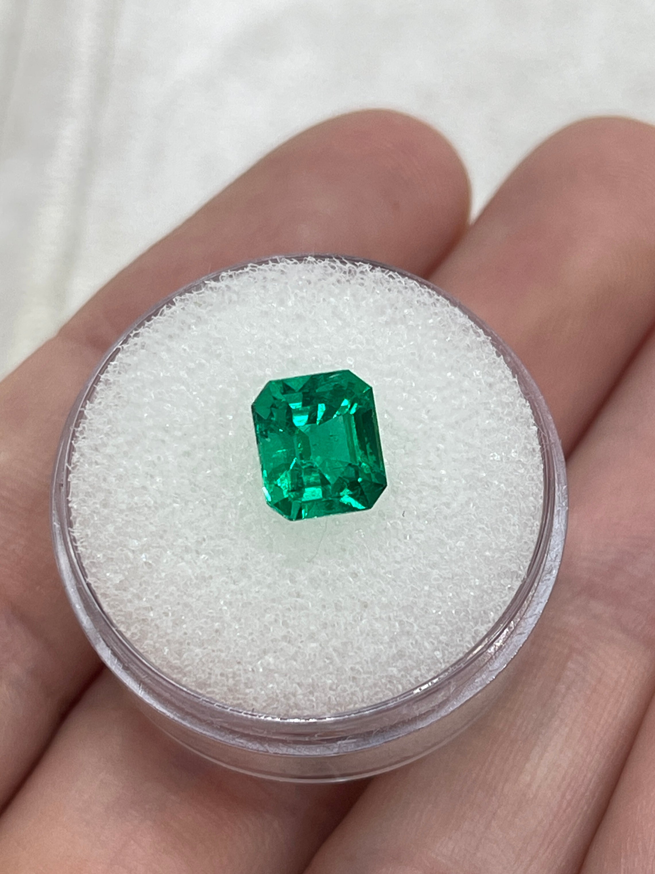 Vivid yellowish green 1.82 carat Colombian emerald loose gemstone in an emerald cut, from JR Colombian Emeralds.