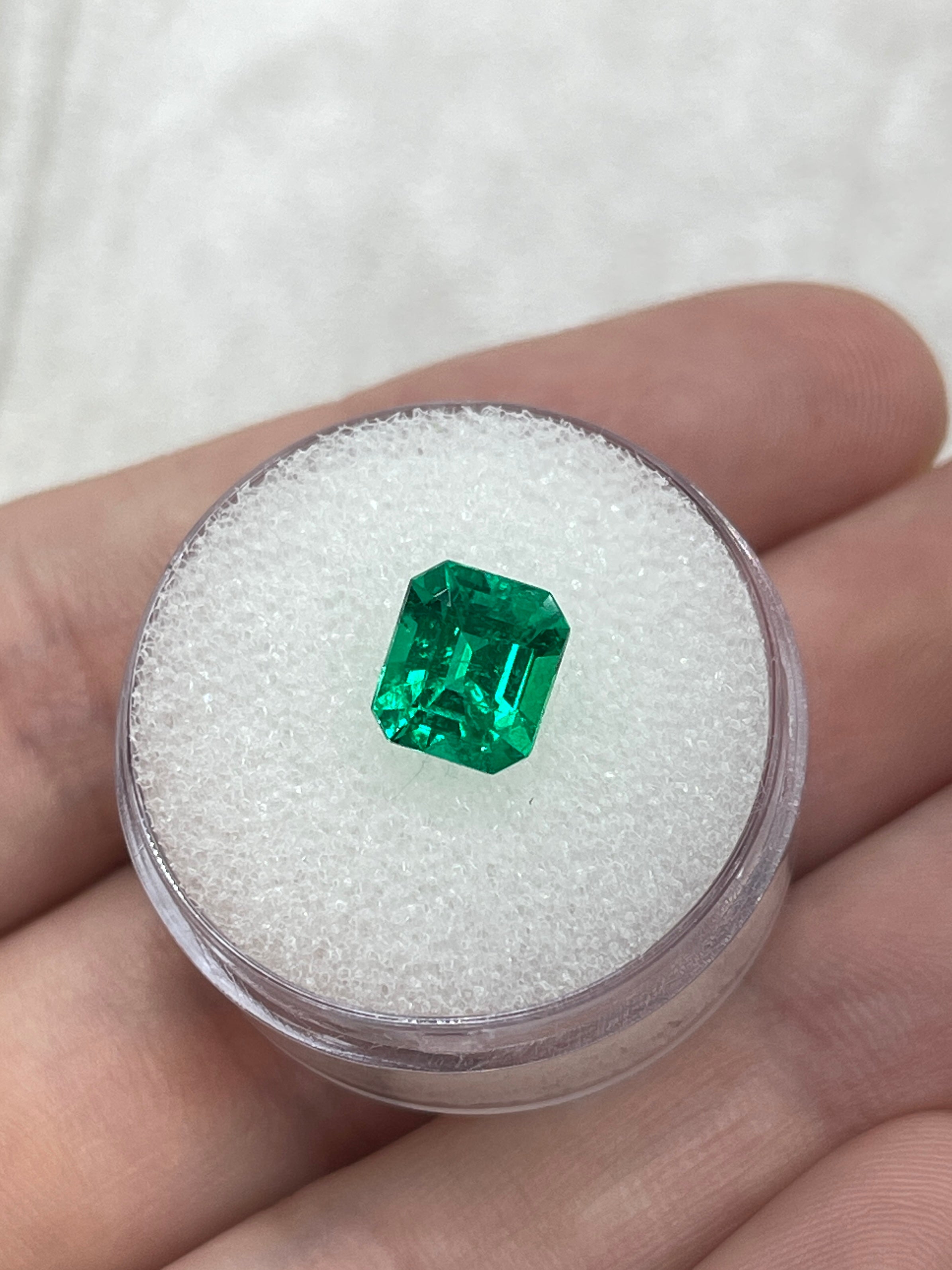 1.82 carat vivid yellowish green Colombian emerald loose gemstone in an emerald cut, showcasing vibrant color and clarity.