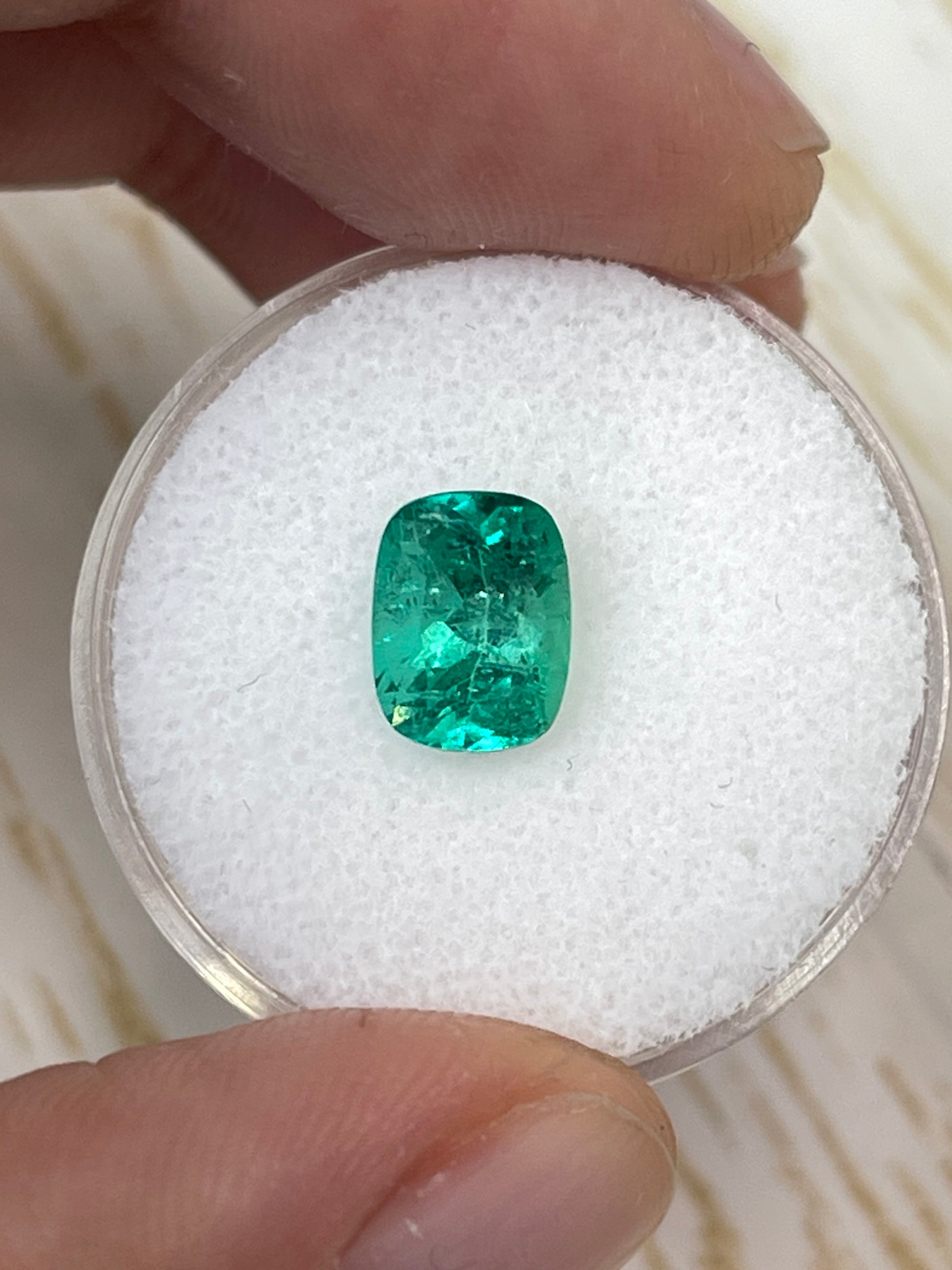 1.84 Carat medium bluish-green natural Colombian emerald loose cushion cut gemstone from JR Colombian Emeralds.