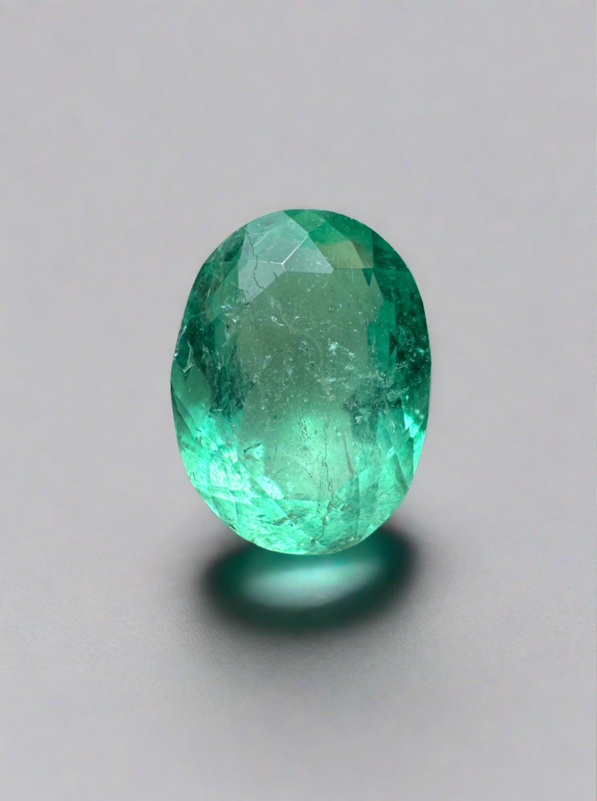 Loose 1.86 carat medium light green Colombian emerald in oval cut, natural gemstone from JR Colombian Emeralds.