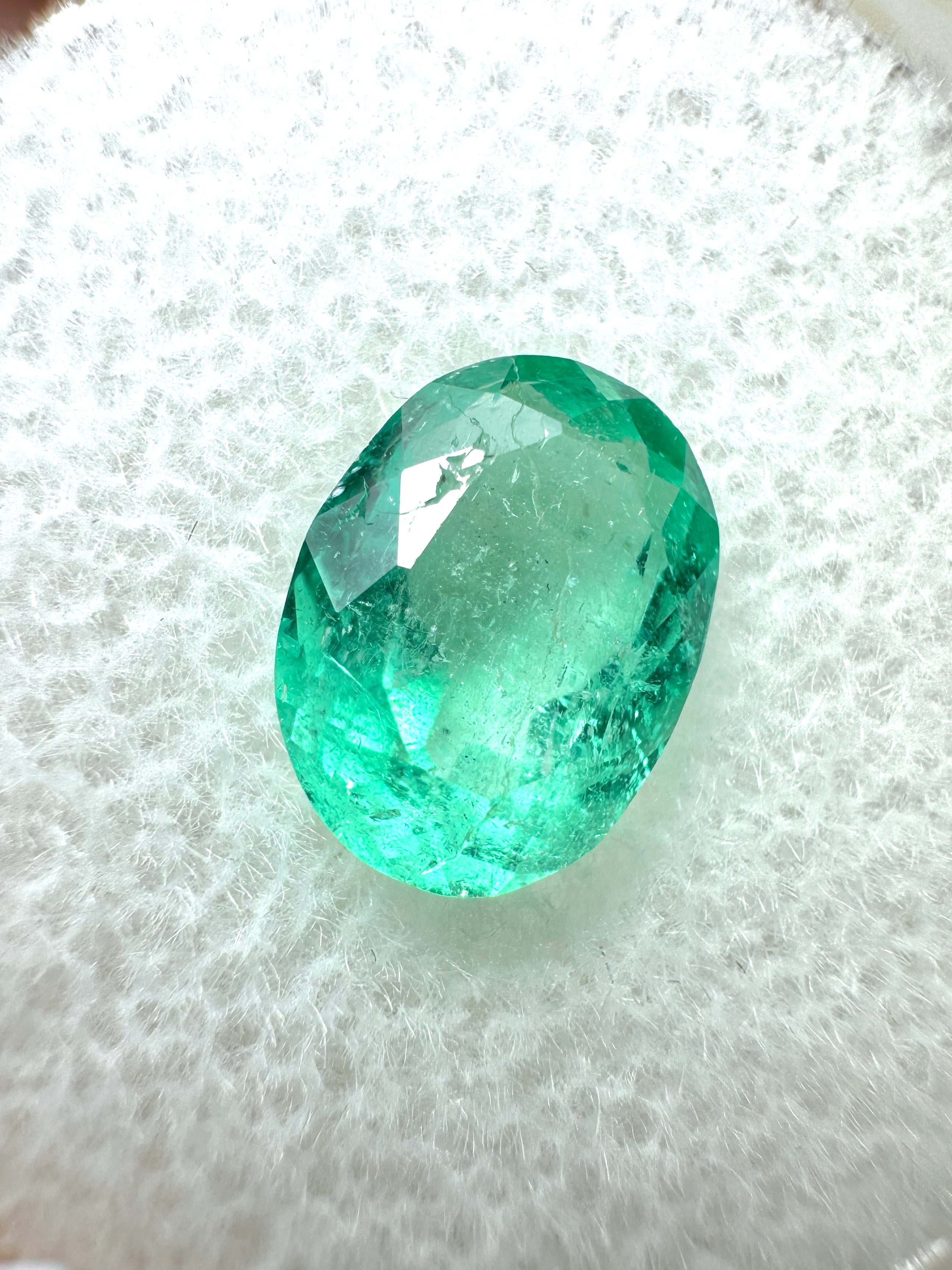 Oval cut 1.86 carat medium light green natural Colombian emerald gemstone from JR Colombian Emeralds.