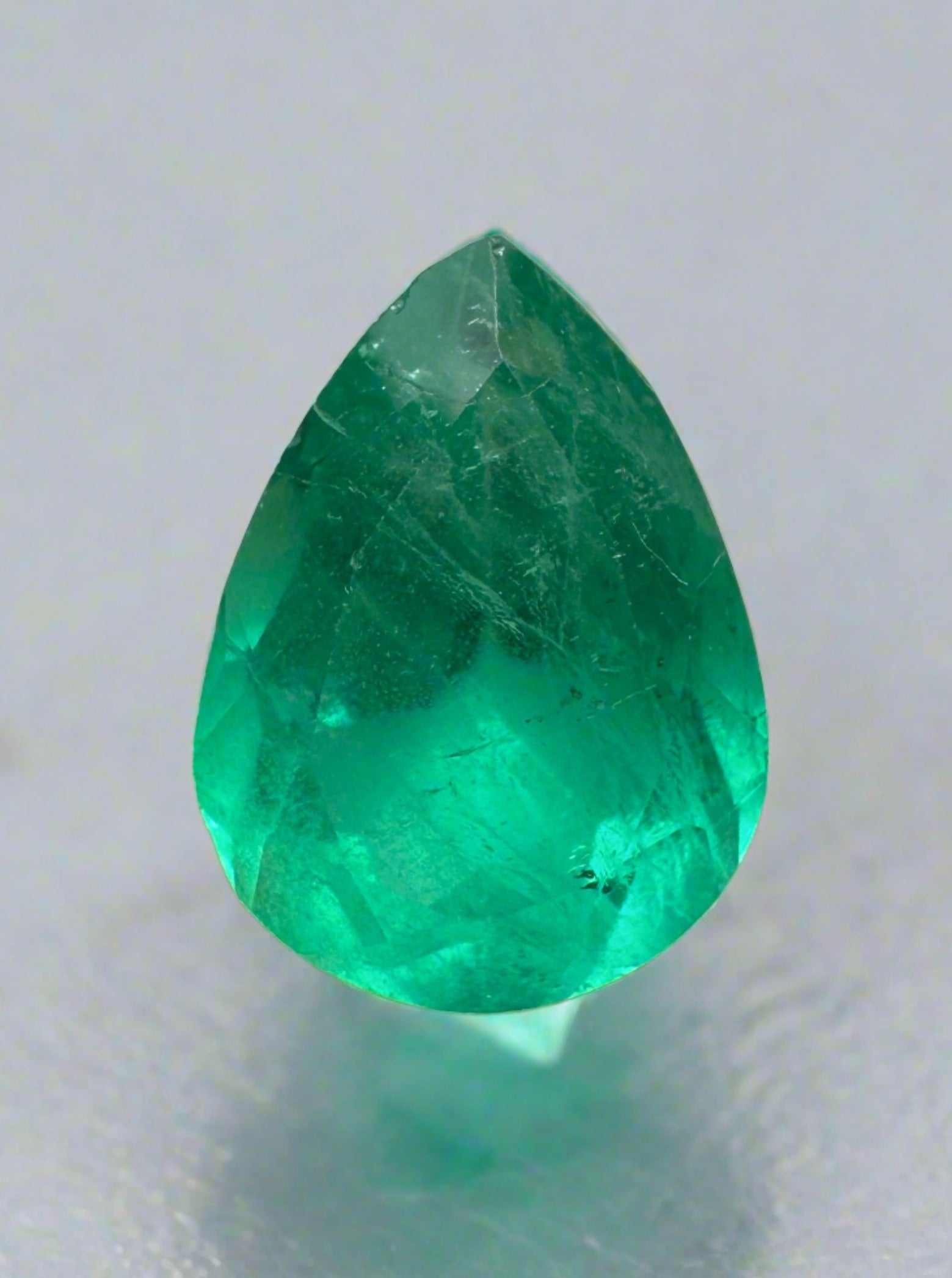 1.88 Carat chunky green natural Colombian emerald in pear cut, loose gemstone from JR Colombian Emeralds.