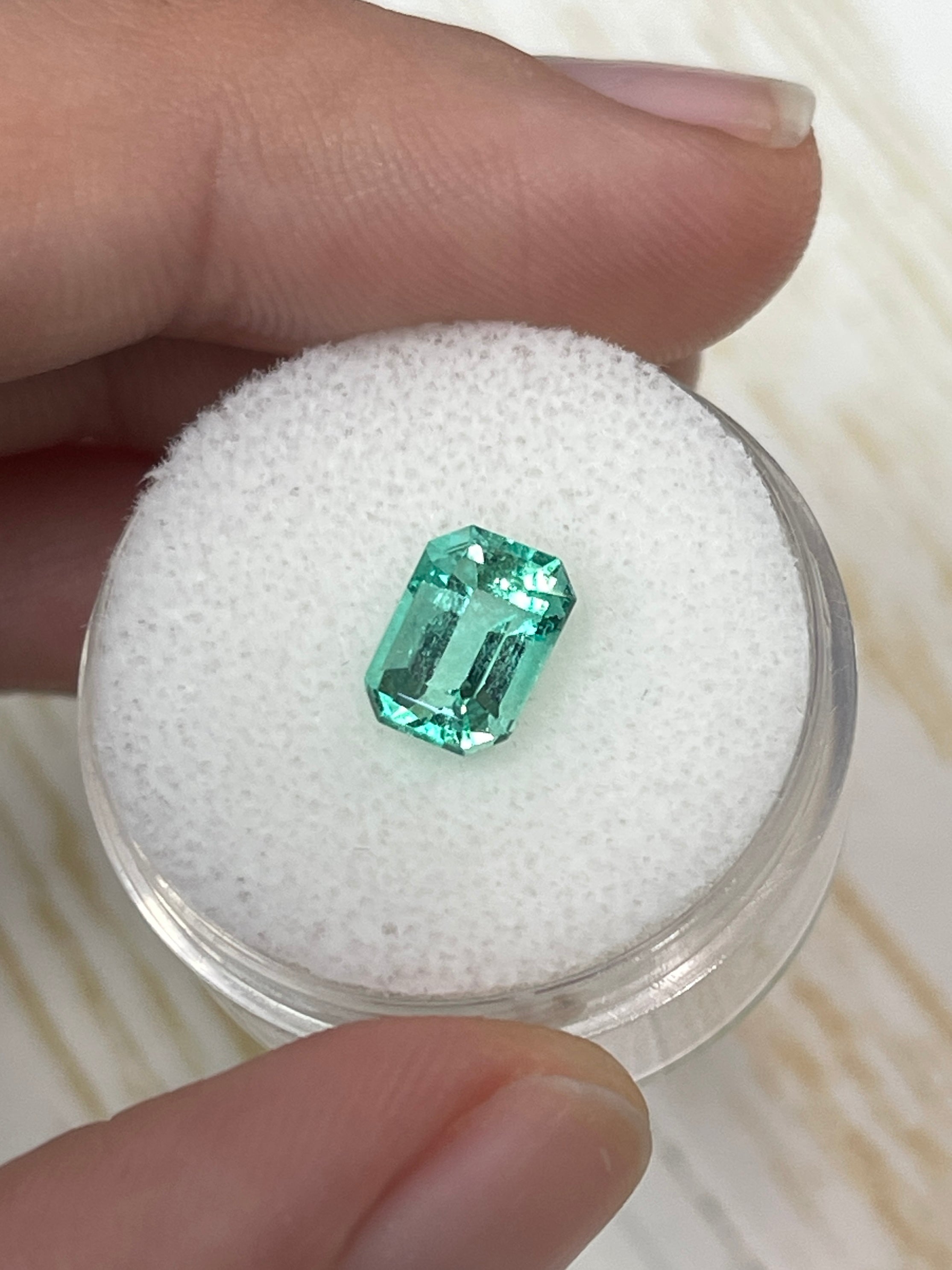 1.91 carat natural Colombian emerald loose gemstone in emerald cut, showcasing vibrant green color and clarity from JR Colombian Emeralds.