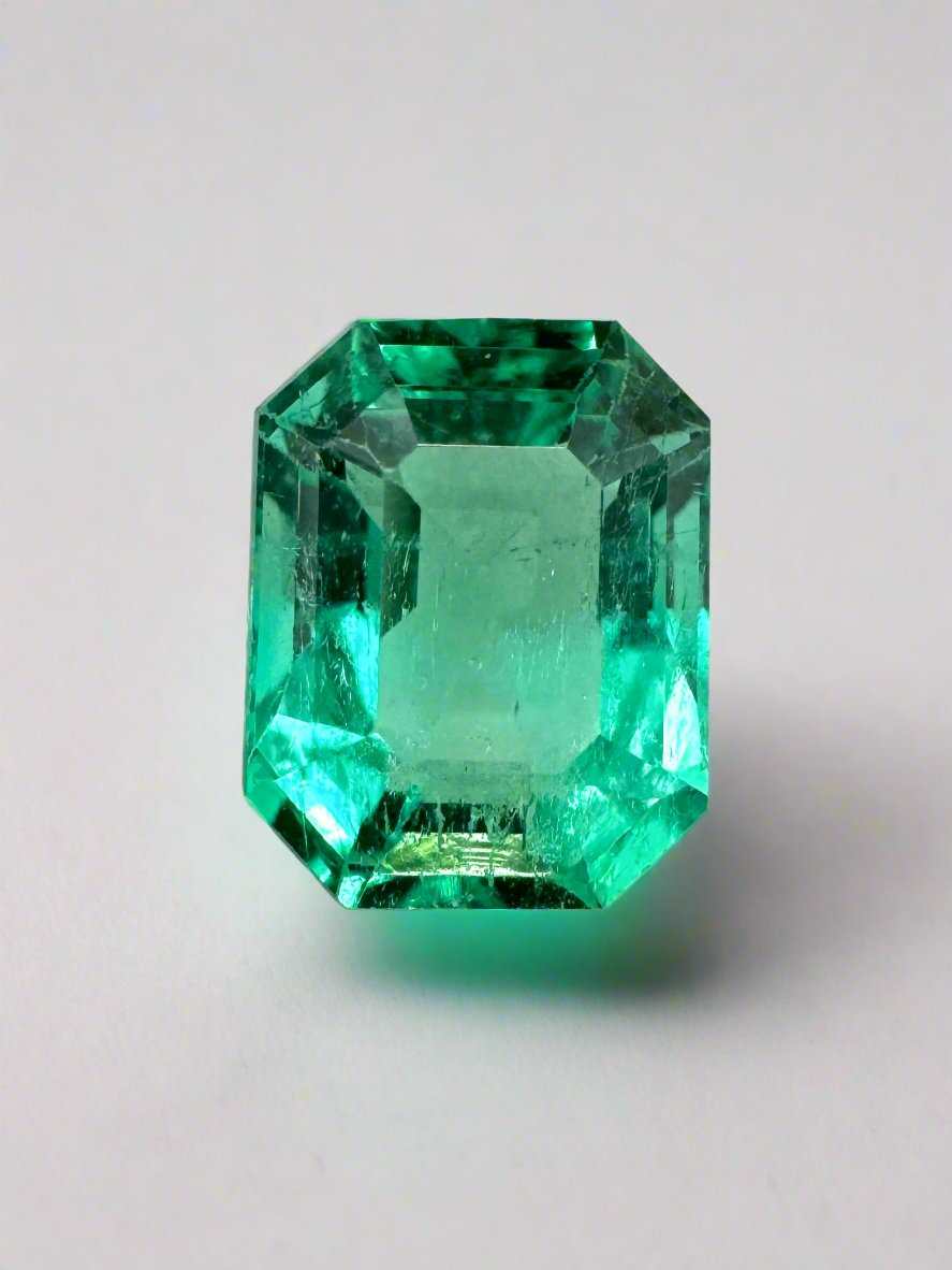 Loose 1.92 carat bluish green Colombian emerald with emerald cut, showcasing its vibrant glow and natural clarity.
