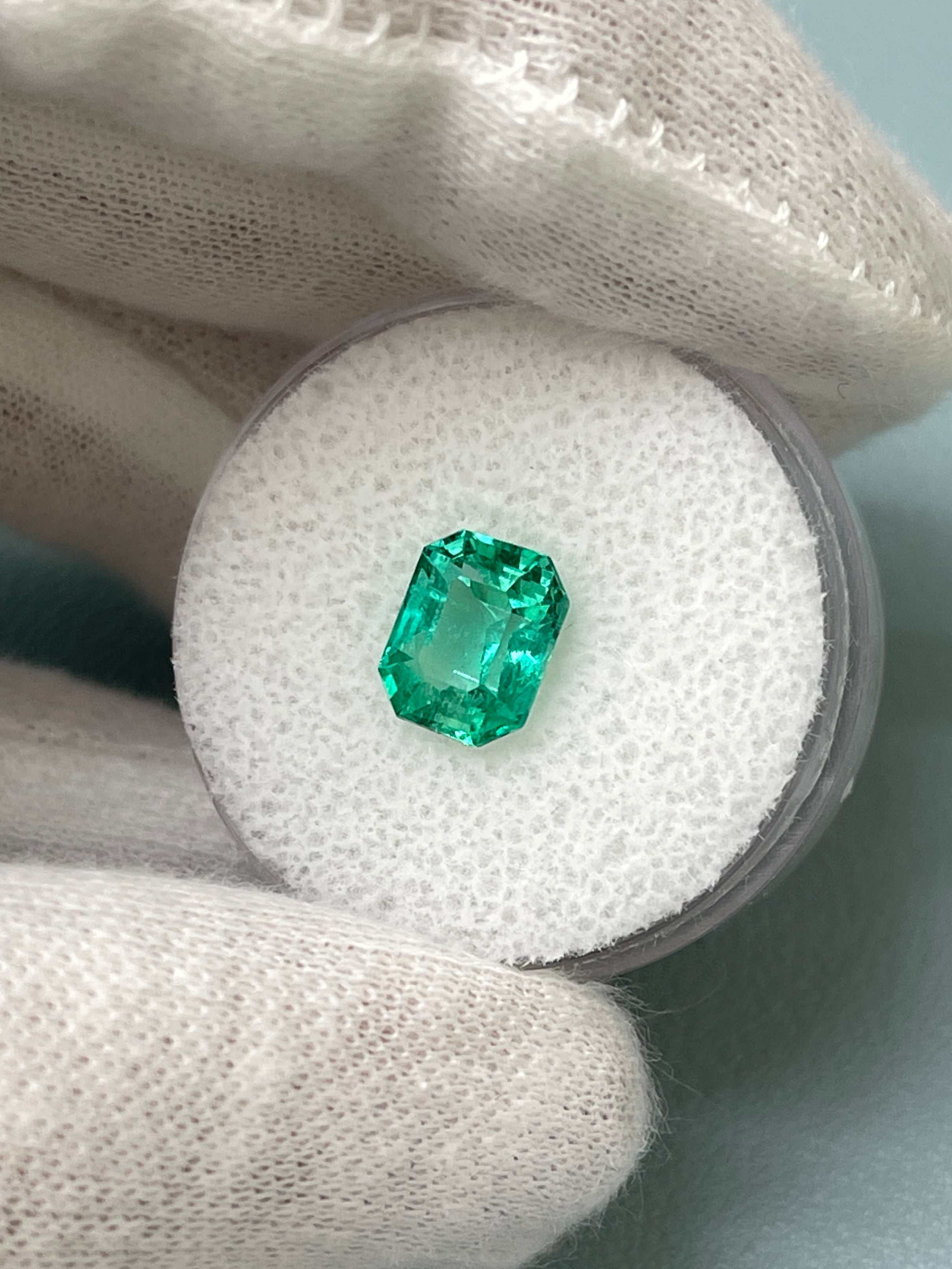 1.92 carat bluish green Colombian emerald loose gemstone in emerald cut, vibrant and glowing from JR Colombian Emeralds.