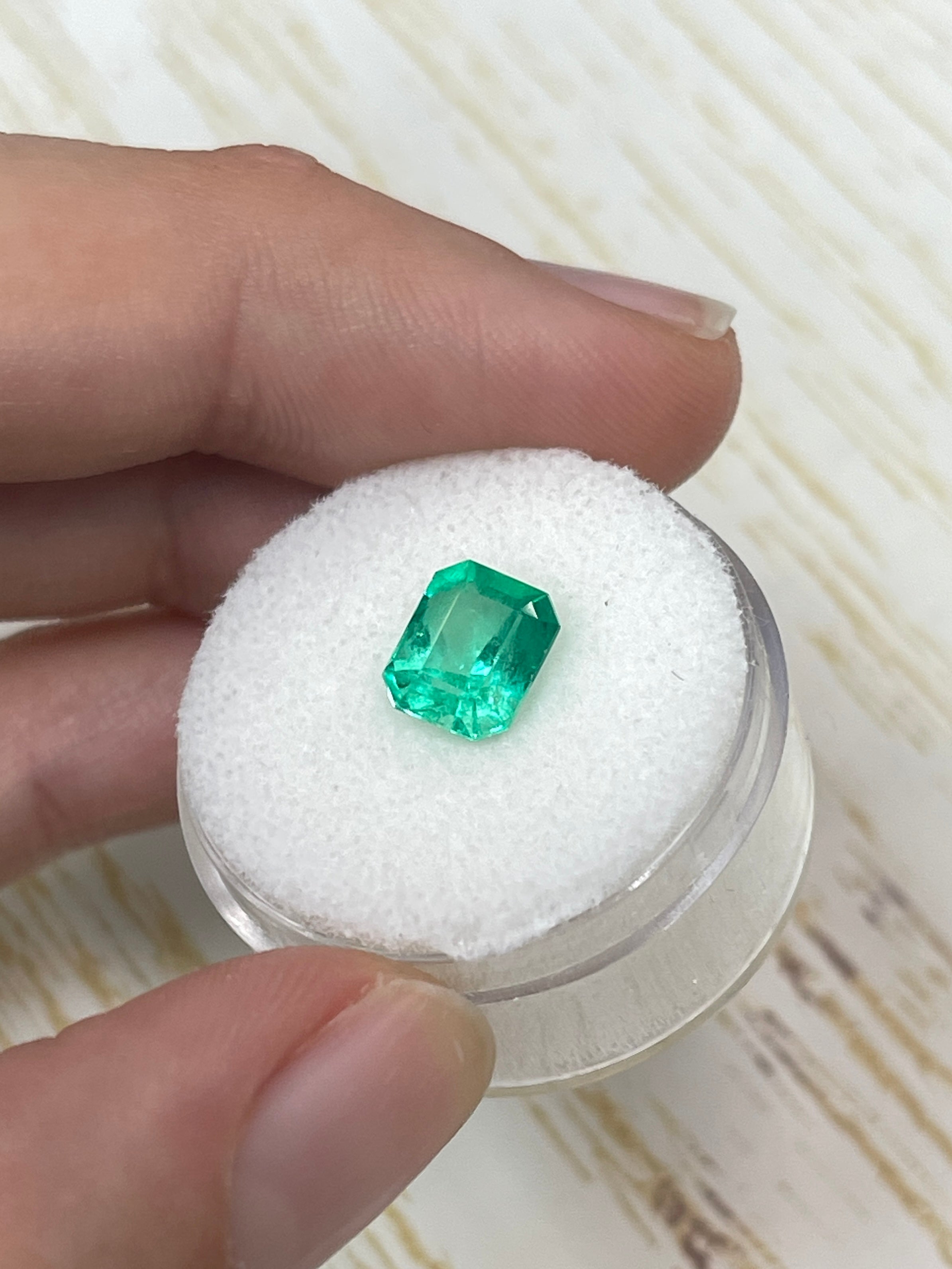 1.92 carat natural Colombian emerald loose gemstone in emerald cut, vibrant Muzo green, from JR Colombian Emeralds.