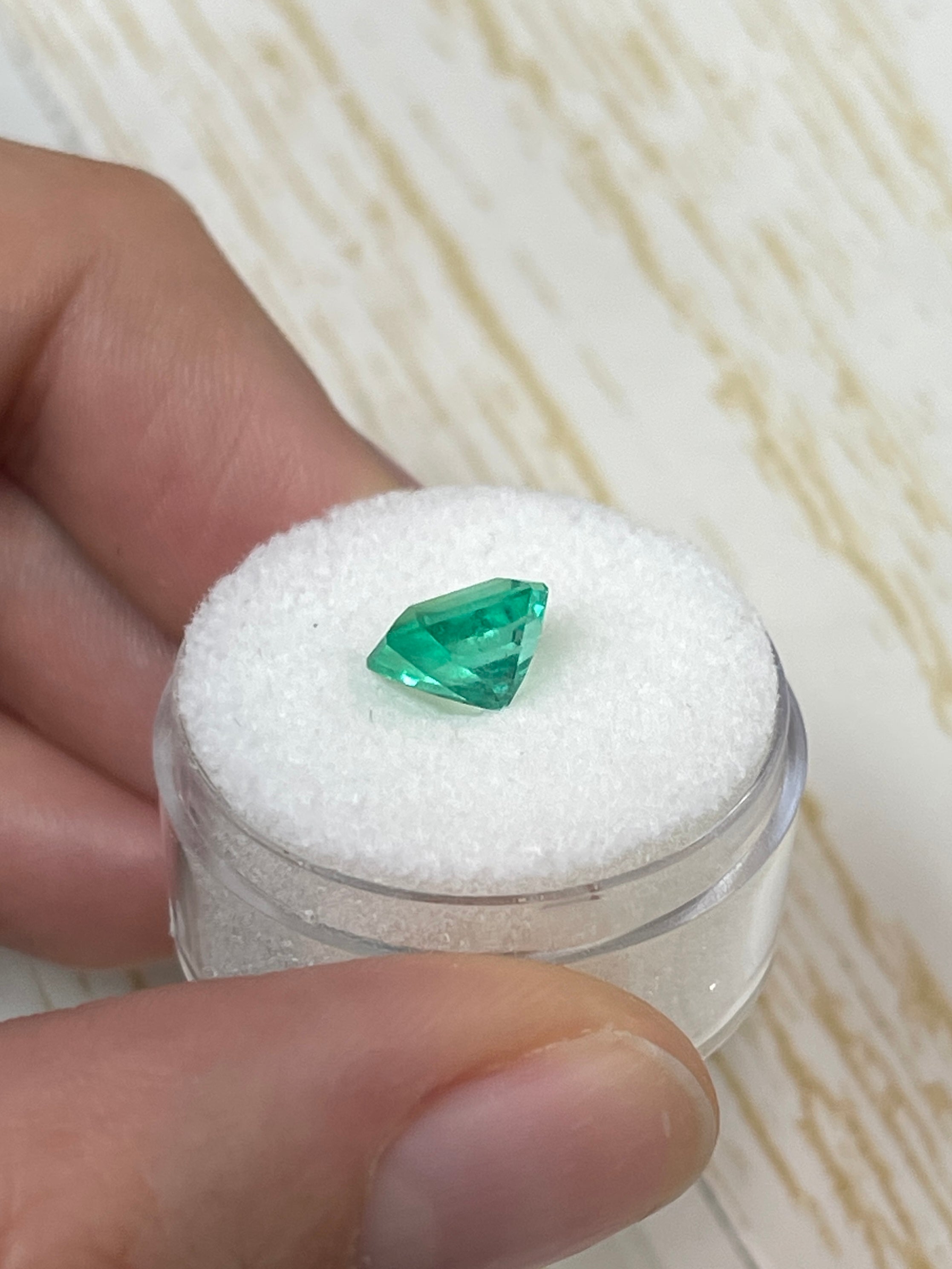 1.92 carat natural Colombian emerald loose gemstone, 8x7mm emerald cut, vibrant Muzo green color, from JR Colombian Emeralds.