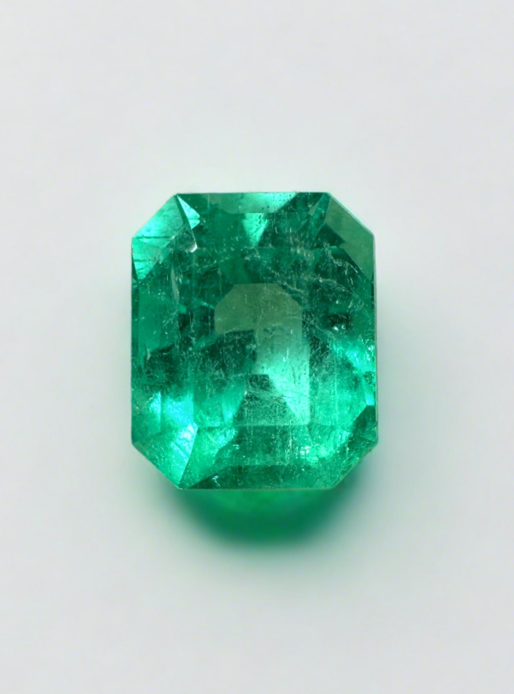 1.92 carat emerald cut Muzo green Colombian emerald loose gemstone from JR Colombian Emeralds, vibrant natural green color.