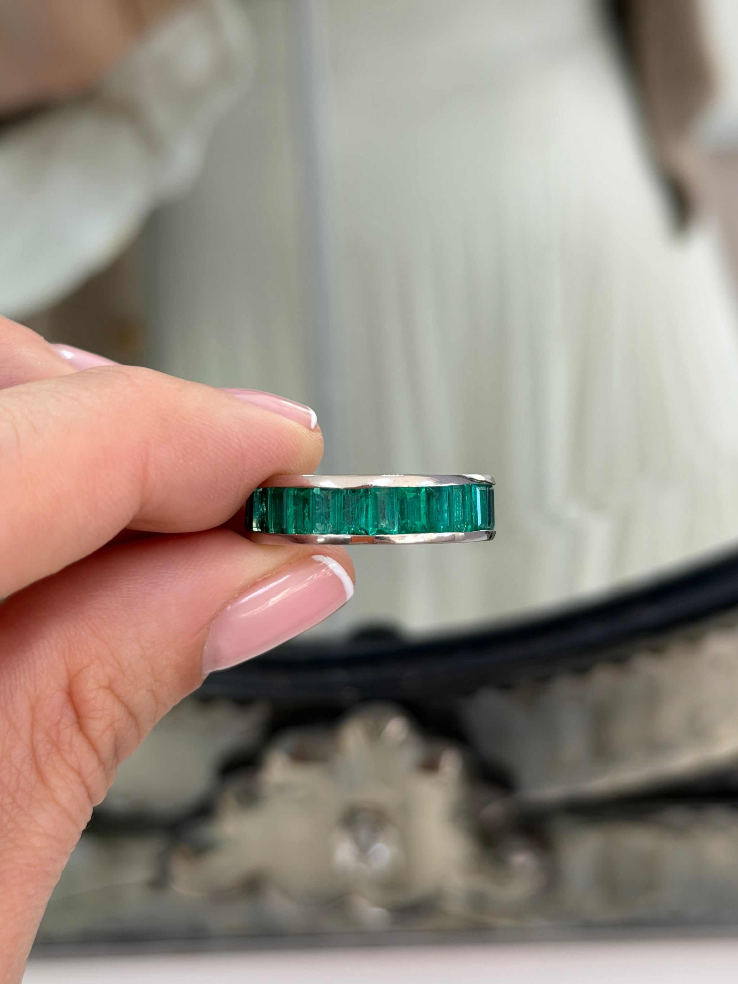 Platinum eternity band featuring 10.05ctw Colombian emeralds and blue sapphires, size 7, by JR Colombian Emeralds.