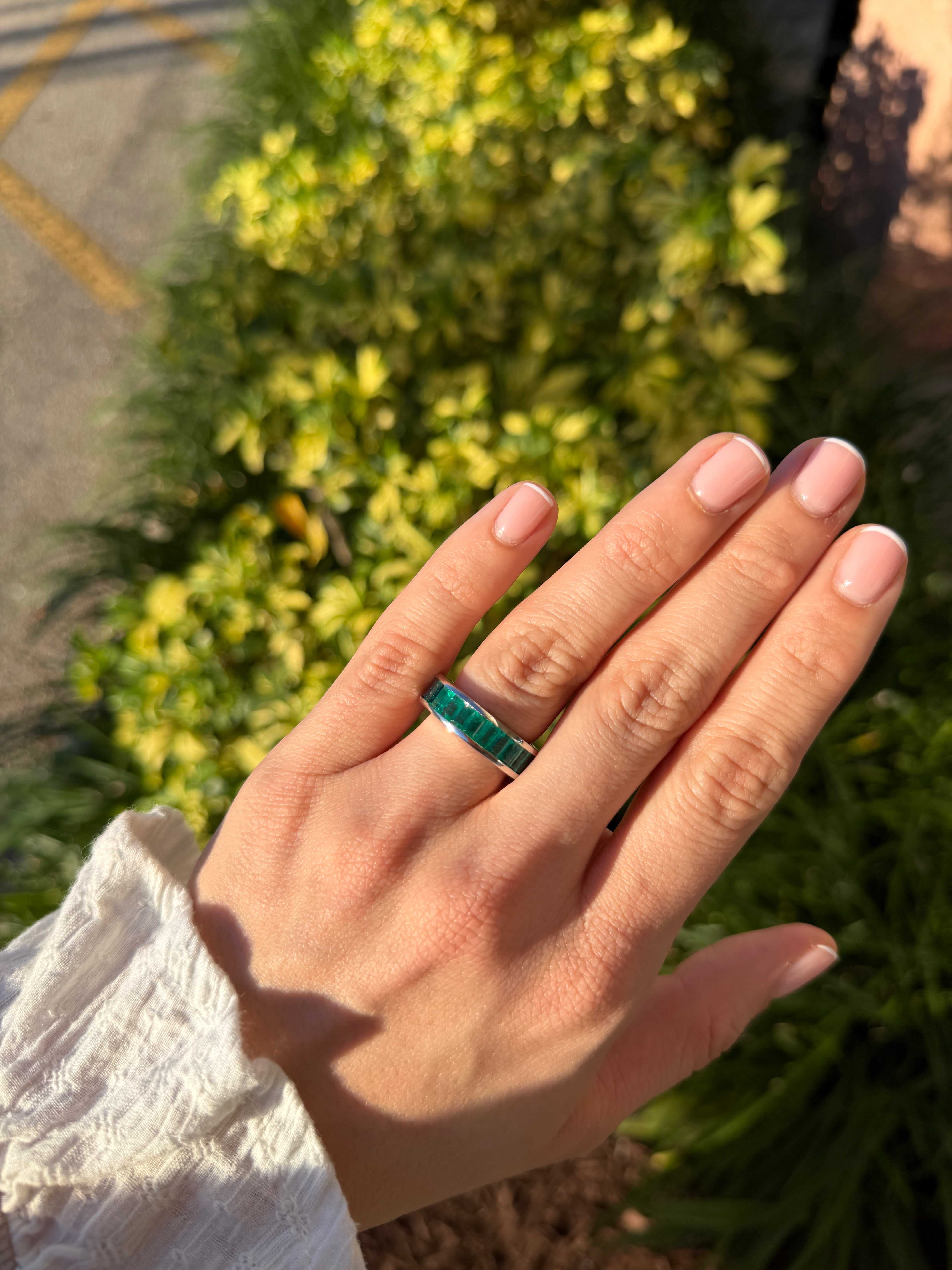 JR Colombian Emeralds platinum eternity band with 10.05tcw AAA+ Colombian emeralds and blue sapphires, size 7, channel set.