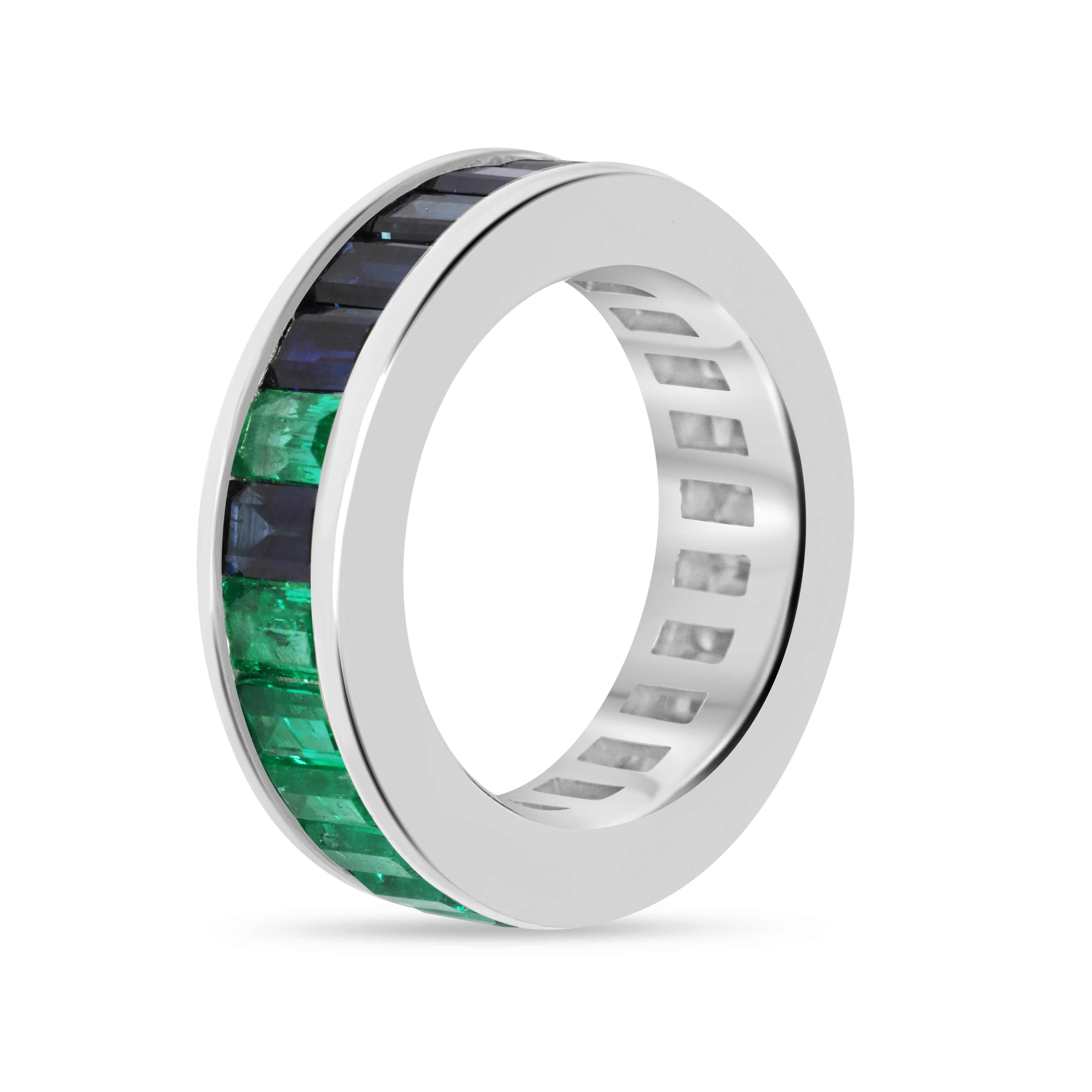 Platinum eternity band with 10.05tcw Colombian emeralds and blue sapphires, size 7, featuring baguette-cut gemstones in a channel setting.