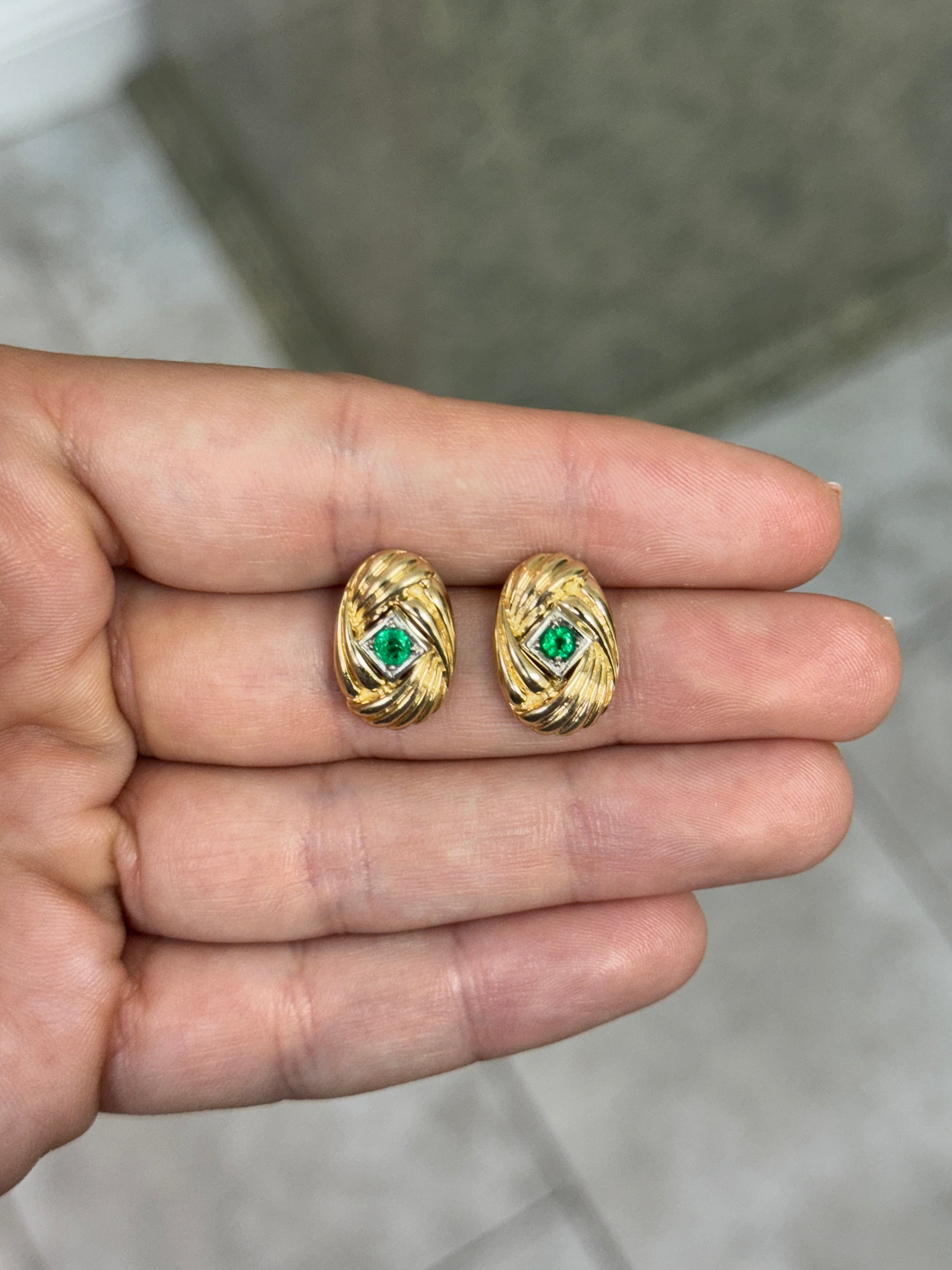14K gold vintage Zambian emerald statement earrings with scroll and vortex design, featuring 0.70tcw Colombian emeralds.