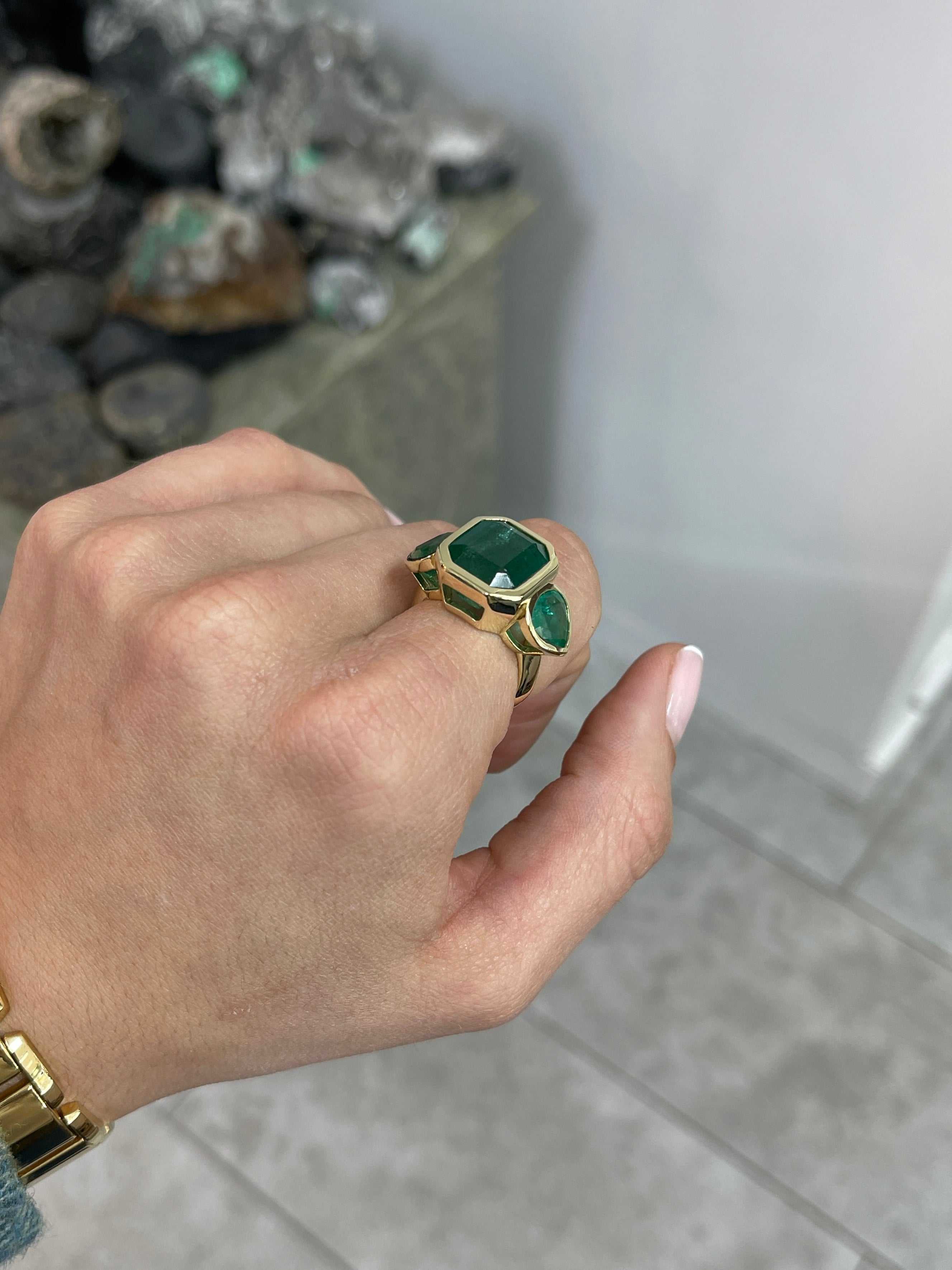 15.44tcw Emerald Cut Emerald and Pear Accents 3 Stone Bezel Ring 18K Gold