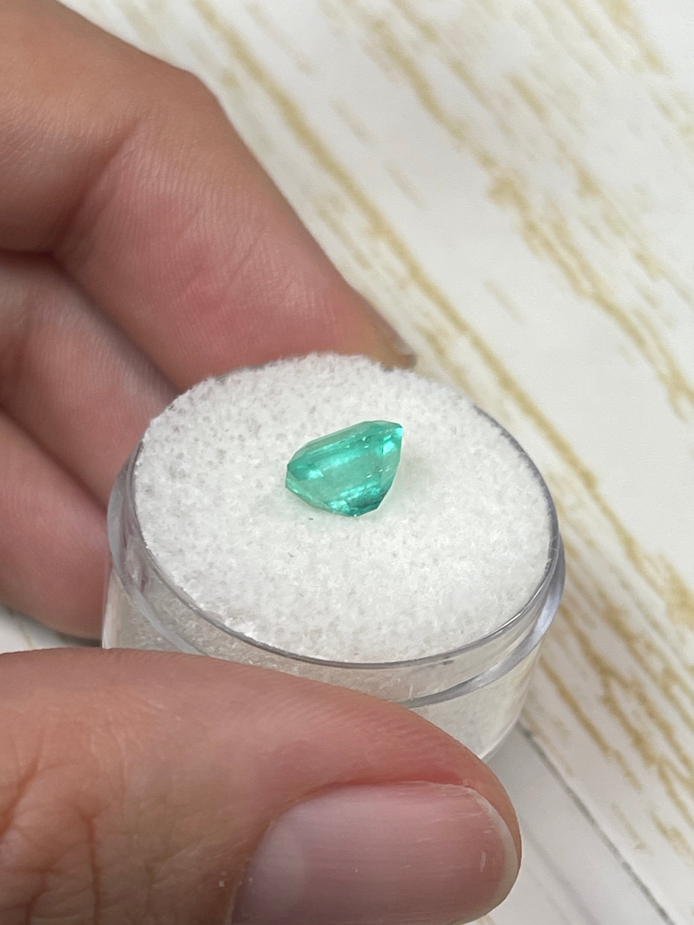 2.03 carat eye-clean bluish green emerald cut Colombian emerald, natural unset gemstone with vibrant color and clarity.