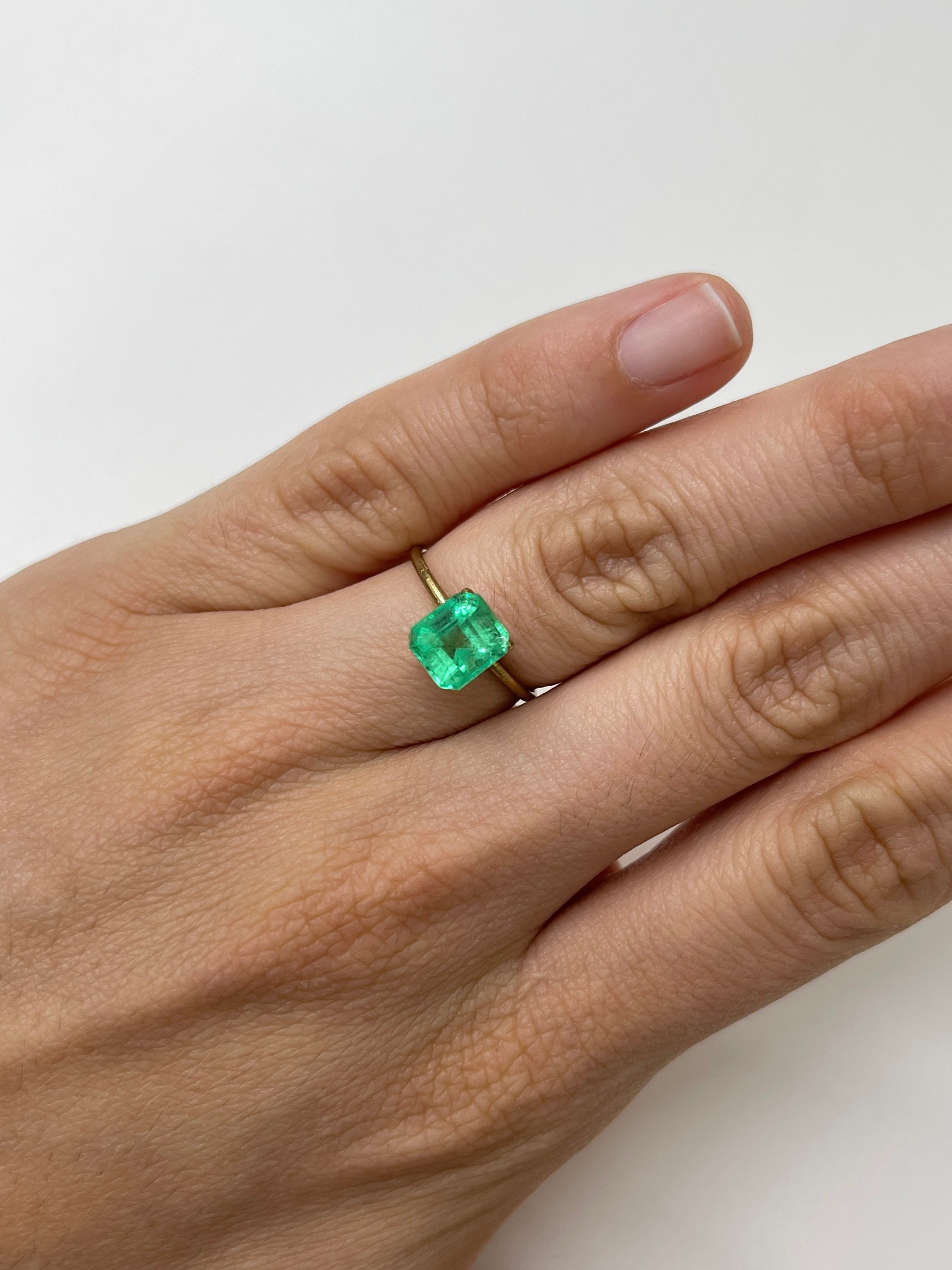 2.08 Carat lime yellowish emerald cut natural Colombian emerald gemstone, unmounted, from JR Colombian Emeralds.